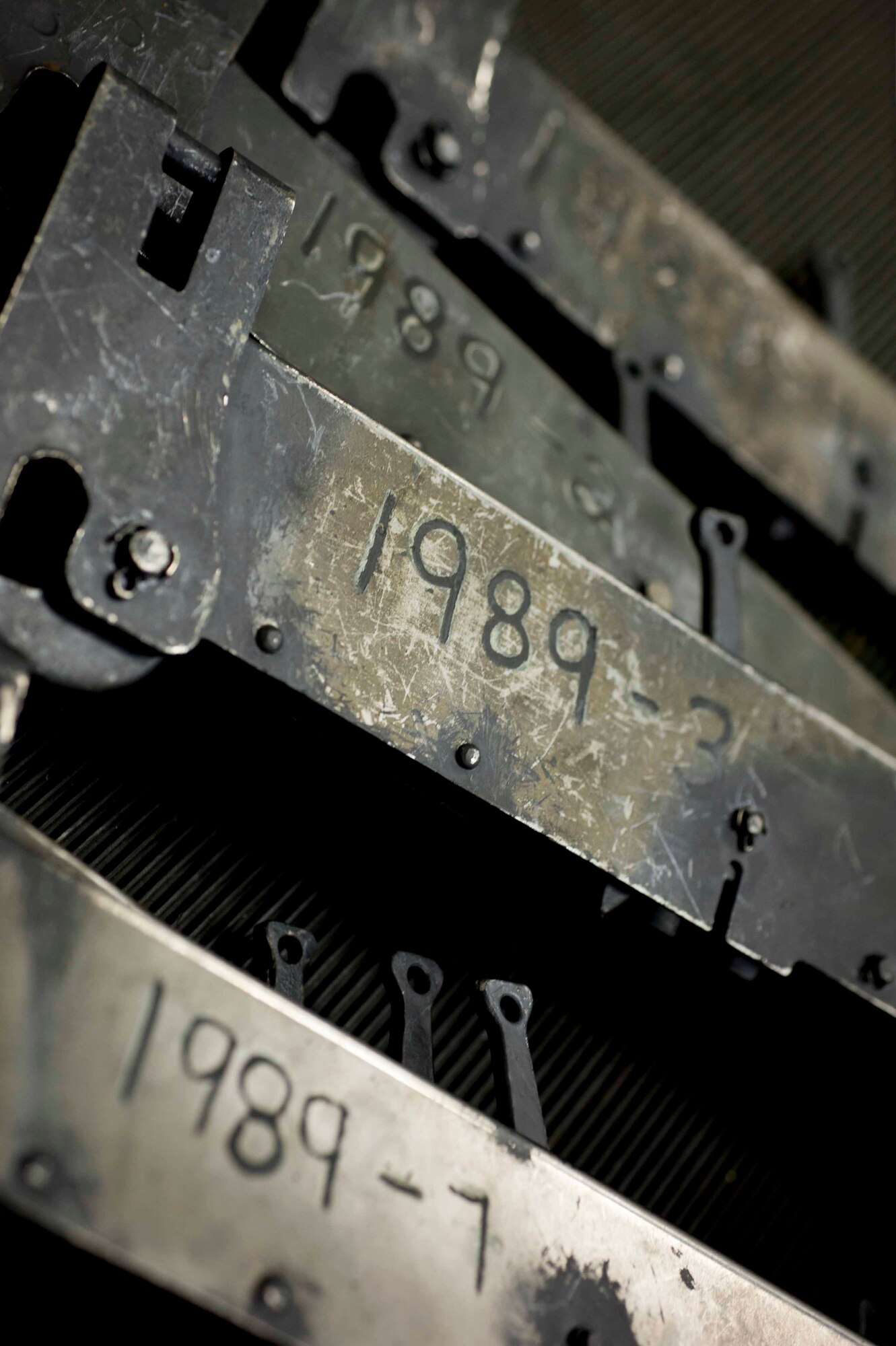 B-11 shackles rest on a cart on Minot Air Force Base, N.D., Feb. 3, 2015. B-11 shackles are used to hold weapons in place on bomb racks. (U.S. Air Force photo/Airman 1st Class Sahara L. Fales)