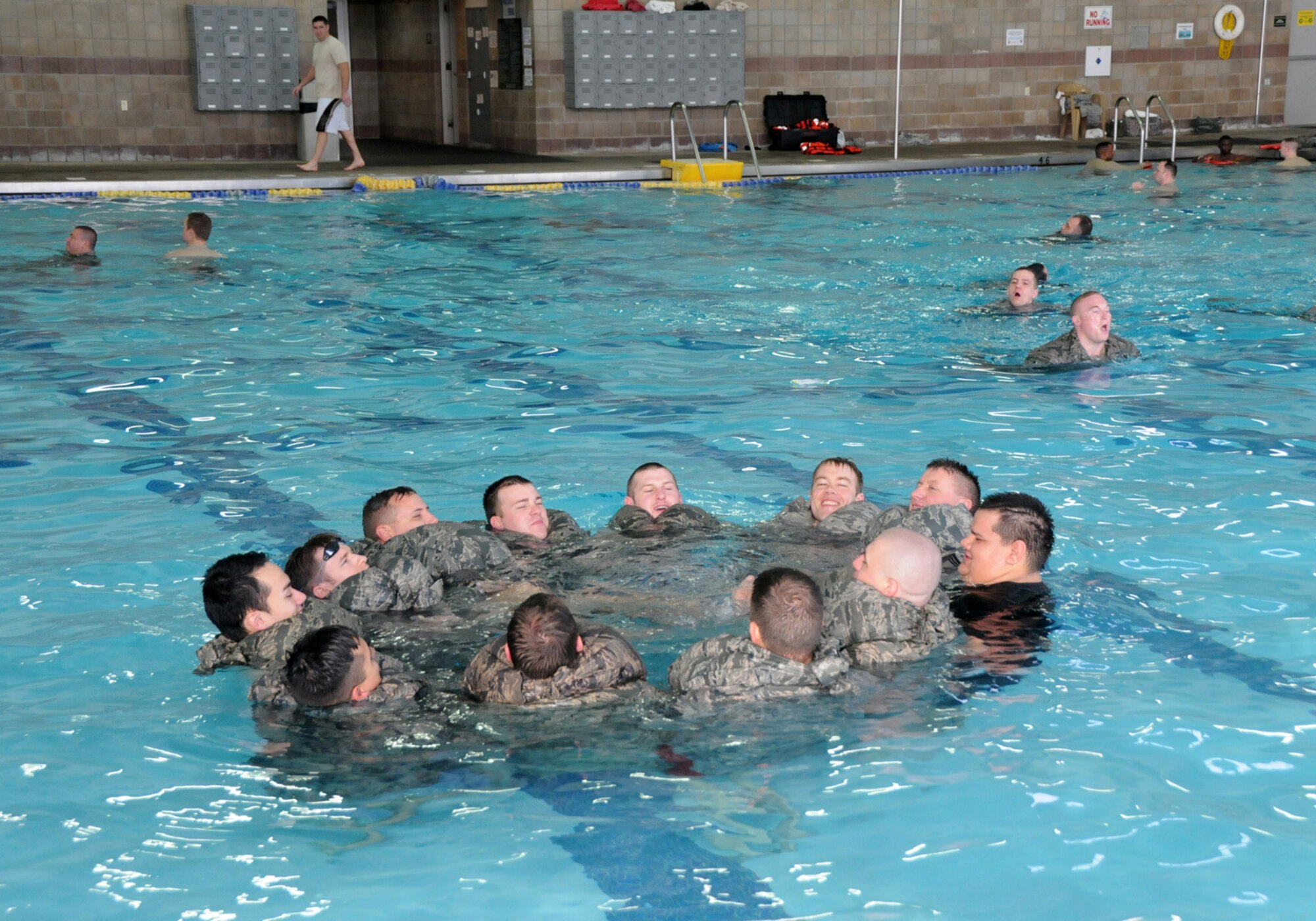 Airmen from the 138th Civil Engineering Squadron participated in a basic water survival course during their unit training assembly Feb. 8, 2015, at the Claremore Super Recreation Center, Claremore, Okla.     The goal of the training was to not only teach water survival skills, but also foster teamwork and build a sense of comradery among CES airmen. (U.S. National Guard photo by Tech. Sgt. Roberta A. Thompson/Released)