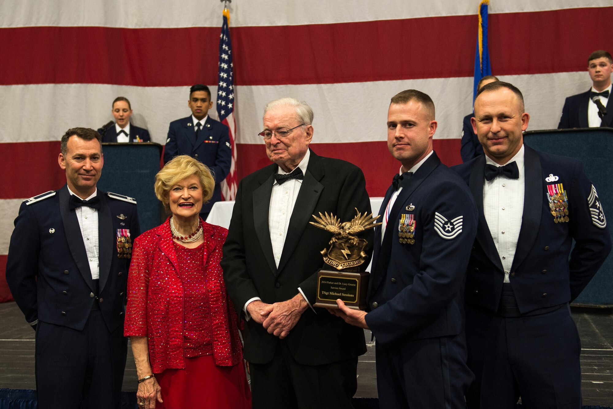U.S. Air Force Tech. Sgt. Sessions, middle right, 723d Aircraft Maintenance Squadron assistant first sergeant, poses with his 2014 Parker and Dr. Lucy Greene Service Award with Moody senior leaders during the 2014 Annual Awards Ceremony Feb. 6, 2015, at Moody Air Force Base Ga. Sessions received the award for his duty performance, community service and earning his bachelor’s degree. (U.S. Air Force photo by Airman 1st Class Dillian Bamman/Released)