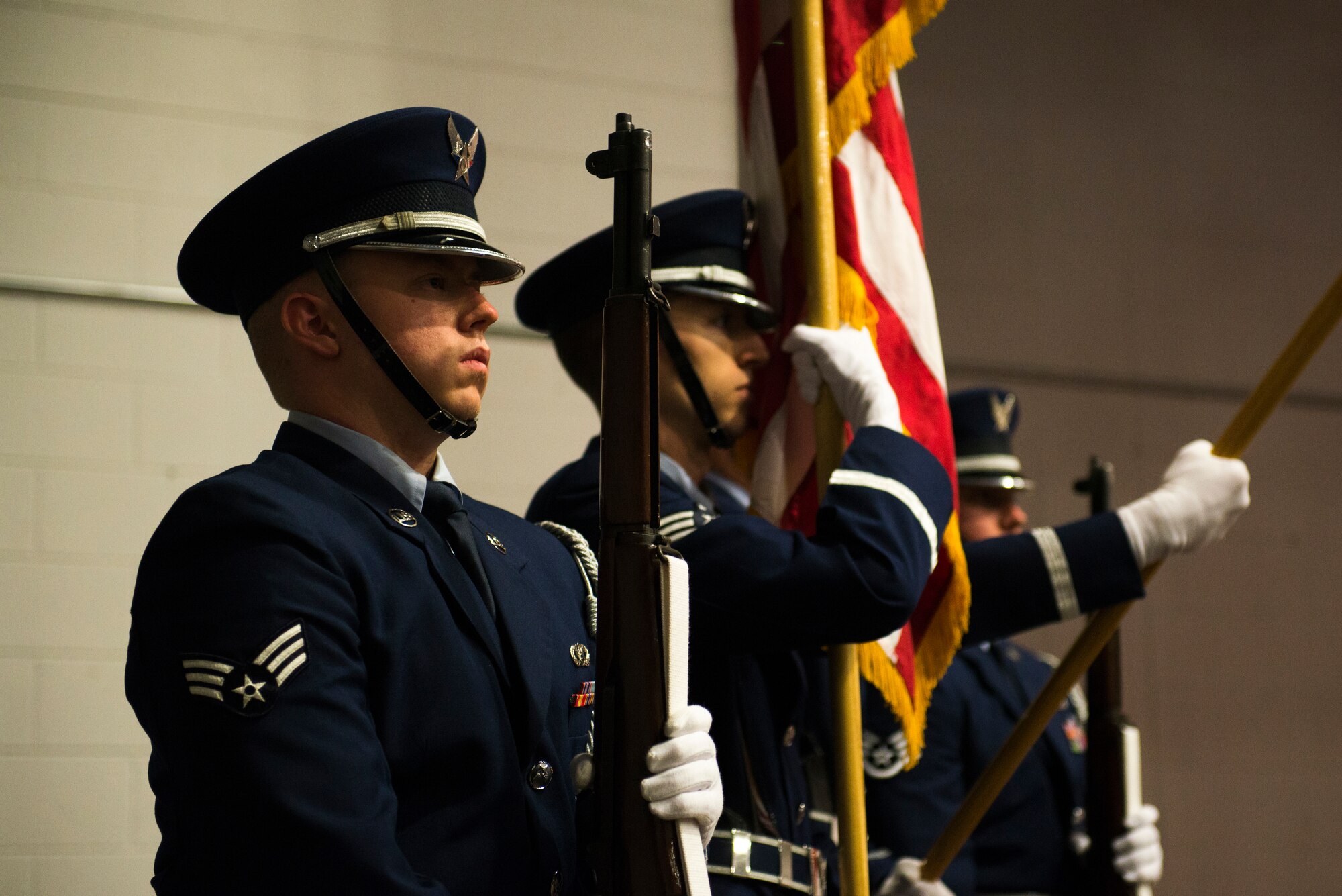 U.S. Air Force Senior Airman Mark Stevenson , 23d Wing honor guardsman, stands during the presenting of the colors during the 2014 Annual Awards Ceremony Feb. 6, 2015, at Moody Air Force Base, Ga. During the ceremony, Senior Airman Caitlin Curran and Airman 1st Class Matthew Manzano, both 23d Maintenance Group, sang the national anthem. (U.S. Air Force photo by Airman 1st Class Dillian Bamman/Released)