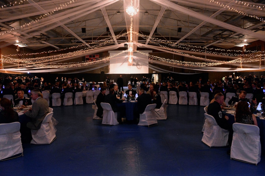 The 52nd Fighter Wing and its community members participate in the 52nd FW 2014 Annual Awards Banquet at the Skelton Memorial Fitness Center at Spangdahlem Air Base, Germany, Feb. 7, 2015. Nearly 400 guests attended the banquet to recognize the top performers in the wing. (U.S. Air Force photo by Airman 1st Class Timothy Kim/Released)