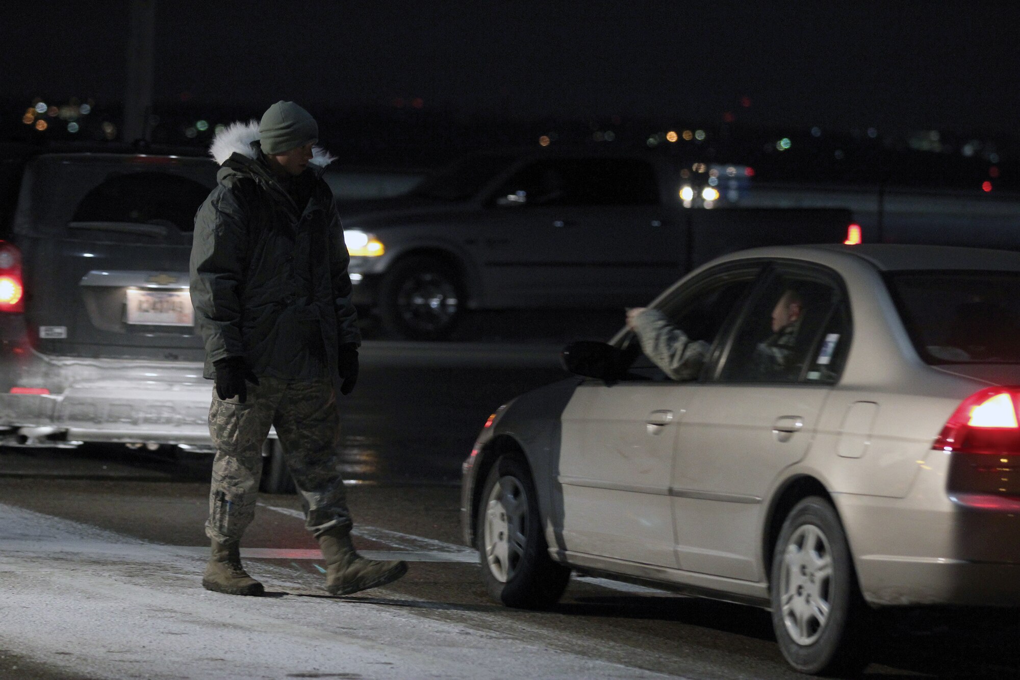 WRIGHT-PATTERSON AIR FORCE BASE, Ohio – Senior Airman Alex Stephens, 445th Security Forces Squadron, handles the flow of traffic entering Gate 26A during the Jan. 11, 2015 445th Airlift Wing unit training assembly. The temperature was 4 below zero. (U.S. Air Force photo/Tech. Sgt. Patrick O'Reilly)