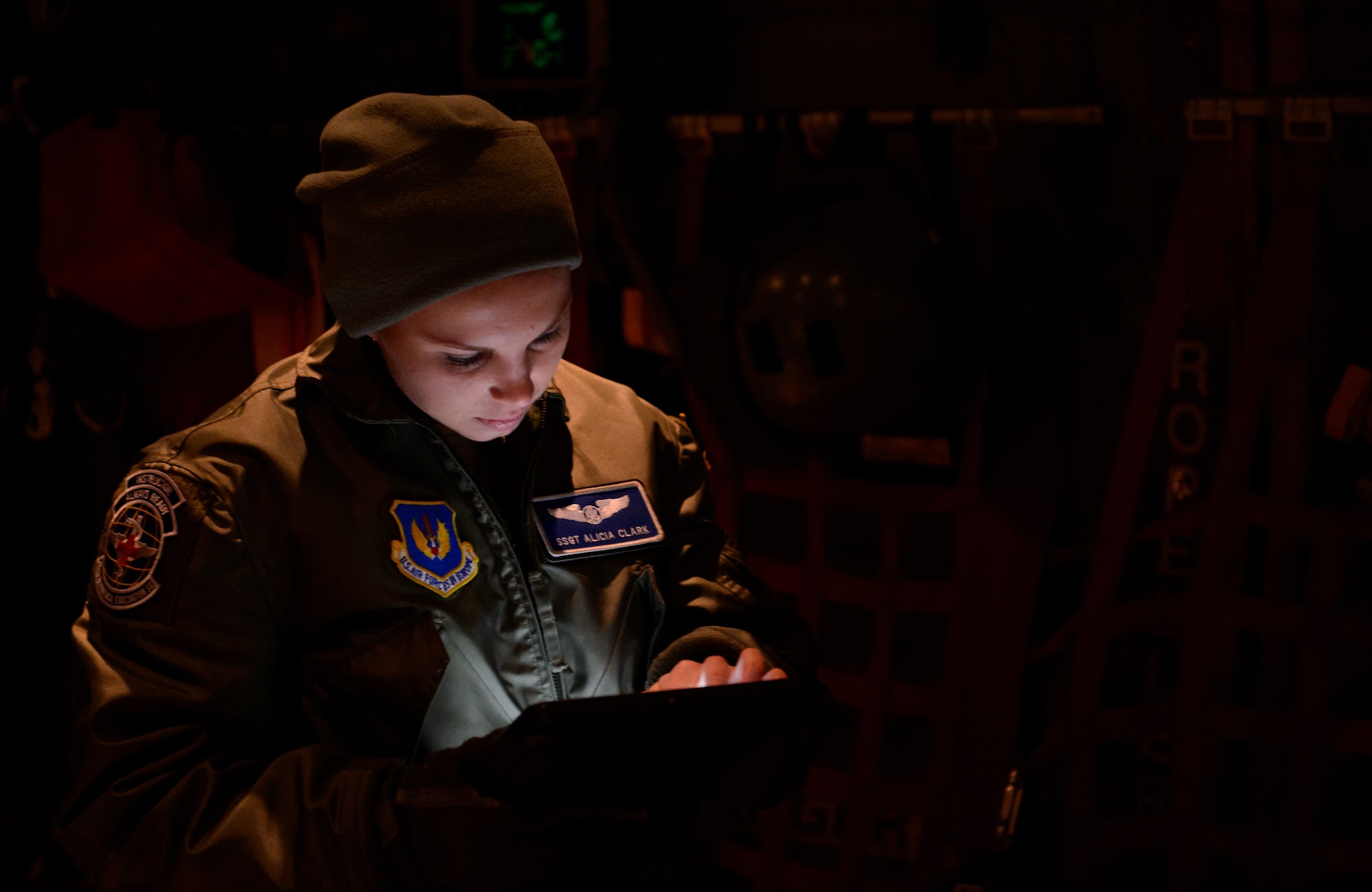 Staff Sgt. Alicia Clark, 86th Aeromedical Evacuation Squadron evaluator, reviews a check list during a check ride sortie at Ramstein Air Base, Germany, Feb. 6, 2015. Clark evaluated a fellow aeromedical evacuation technician to test her ability to perform safely and correctly. (U.S. Air Force photo/Senior Airman Armando A. Schwier-Morales)  