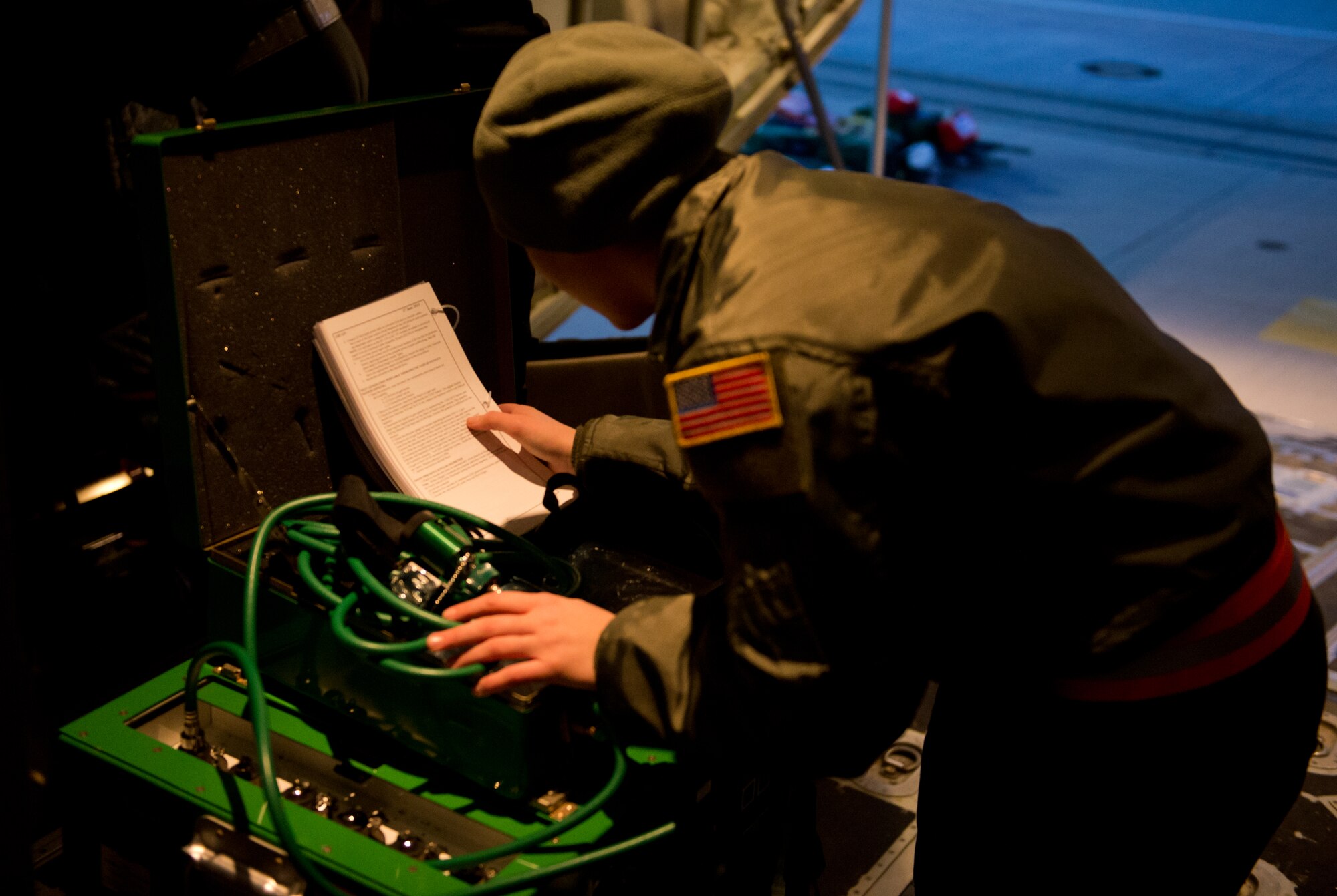 Staff Sgt. Kelsey Carli, 86th Aeromedical Evacuation Squadron technician, reviews her checklist to ensure the proper installation of medical equipment, Ramstein Air Base, Germany, Feb. 6, 2015. Carli was one of several Airmen conducting her check ride, a flight designed to ensure crewmembers can perform the necessary tasks safely, efficiently and correctly. (U.S. Air Force photo/Senior Airman Armando A. Schwier-Morales) 