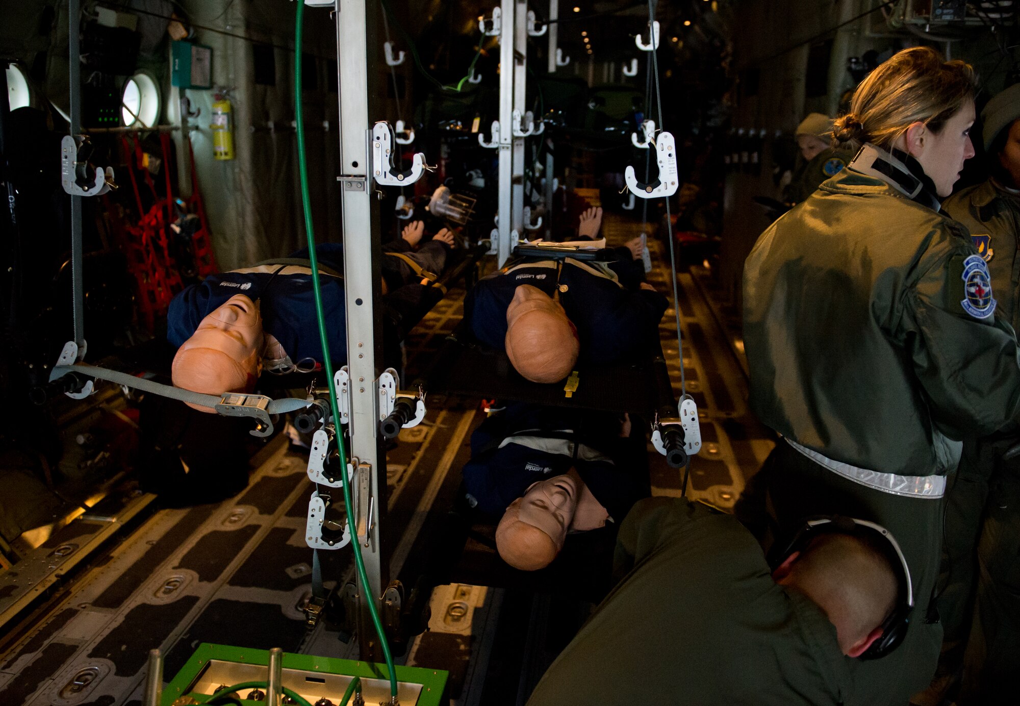 Members of the 86th Aeromedical Evacuation Squadron tend to mannequins as they prepare to take off at Ramstein Air Base, Germany, Feb. 6, 2015. The Airmen participated in a check ride, which evaluates their ability to conduct their job safely and accurately. (U.S. Air Force photo/Senior Airman Armando A. Schwier-Morales) 