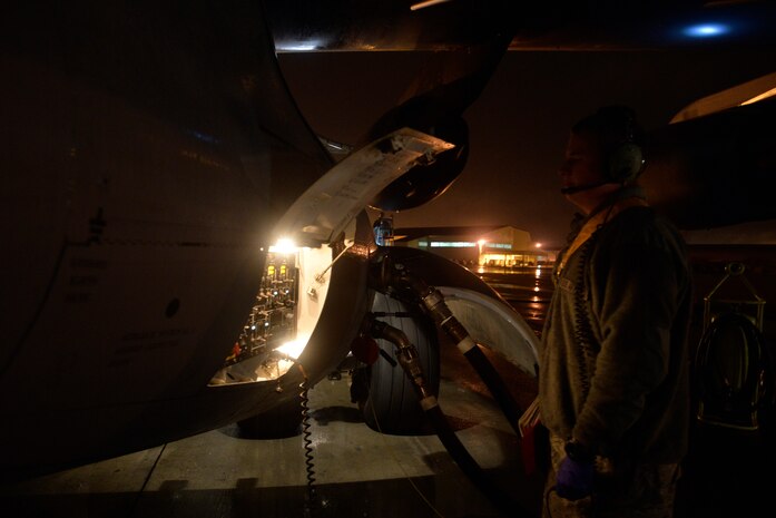 Senior Airman Zachary Elkins, a crew chief with the 437th Aircraft Maintenance Squadron, monitors the maintenance panel of a C-17 Globemaster III during refueling at Joint Base Charleston, S.C., Feb. 9, 2015. Elkins belongs to the gold aircraft maintenance unit and works the swing shift, from 3 p.m. to 11 p.m. (U.S. Air Force photo/Tech. Sgt. Renae Pittman)