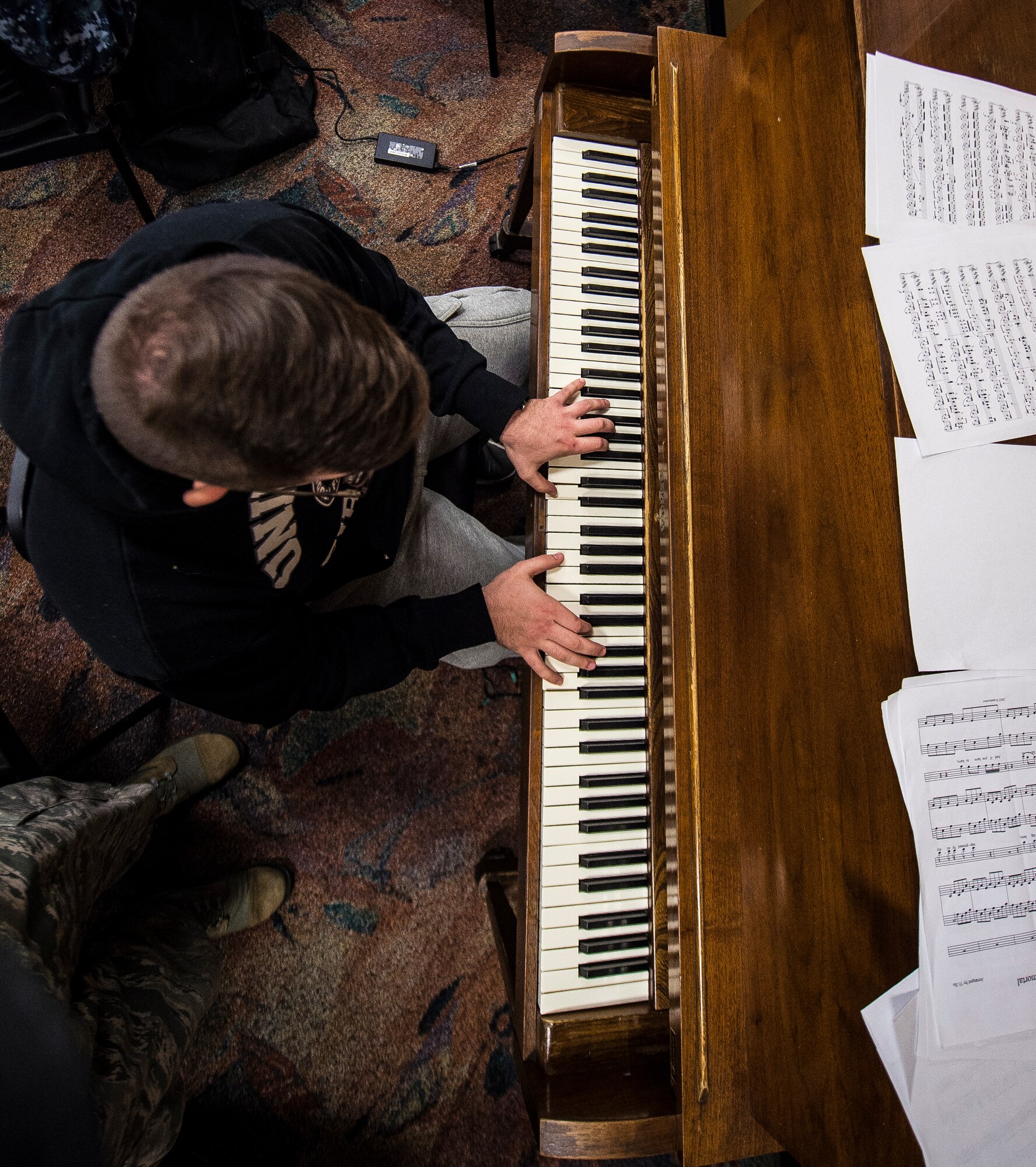 Petty Officer 3rd Class Daniel Yesenofki, Nuclear Power Training Unit student, plays a piano inside the Bowman Center Feb. 9, 2015, at Joint Base Charleston Weapons Station. Yesenofki has completed the six-month course at Naval Nuclear Power Training Command and is nearing completion of his follow-on NPTU training. (U.S. Air Force photo/ Senior Airman Dennis Sloan)