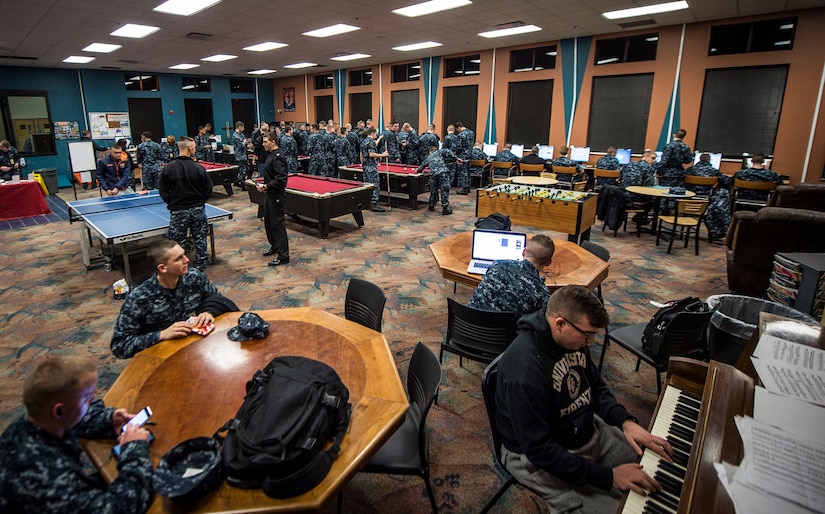 Naval Nuclear Power Training Command and Nuclear Power Training Unit students play games, music or search the internet in the Bowman Center Feb. 9, 2015, at Joint Base Charleston – Weapons Station. Altogether, approximately 3,300 students attend these schools, with 500 instructors. (U.S. Air Force photo/ Senior Airman Dennis Sloan)