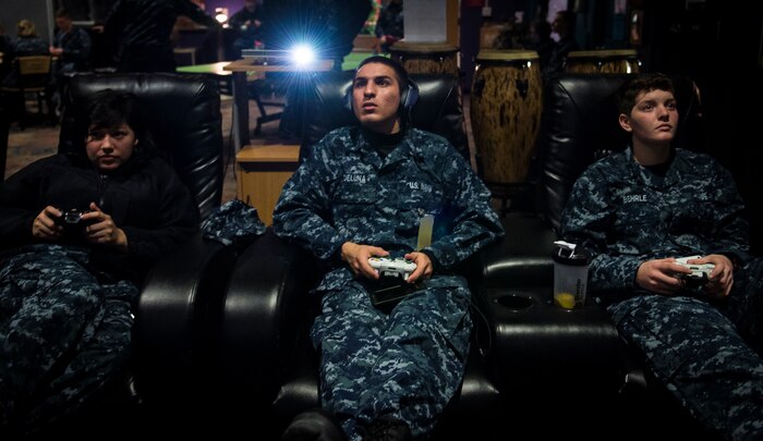 Naval Nuclear Power Training Command student play video games in the Bowman Center after a long day of classes Feb. 9, 2015, at Joint Base Charleston – Weapons Station. NNPTC students undergo rigorous schooling to learn about the operation, maintenance and supervision of naval nuclear propulsion plants. The Bowman Center and its many activities afford students a welcome relief from their classes.  (U.S. Air Force photo/ Senior Airman Dennis Sloan)