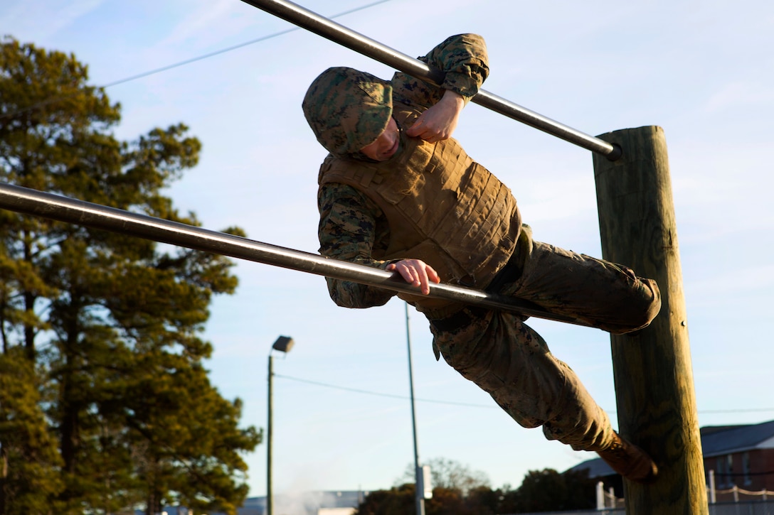 Marine Corps Sgt. John R. Hicks runs through an obstacle course during a martial arts instructor course on Marine Corps Air Station Cherry Point, N.C., Jan. 29, 2015. Hicks is a master training specialist assigned to the Center of Naval Aviation Technical Training.