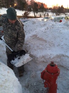 Staff Sgt. Jon Bohannon, a dispersing manager of the 101st Finance Detachment, Massachusetts Army National Guard, clears out fire hydrants during clean-up operations in the wake of Winter Storm Marcus, Feb. 10, 2015, in West Newton. Approximately 200 Massachusetts National Guard Soldiers and Airmen were initially activated to augment the state’s snow clearing efforts after six feet of snow was dumped on the New England area during the past few weeks. 