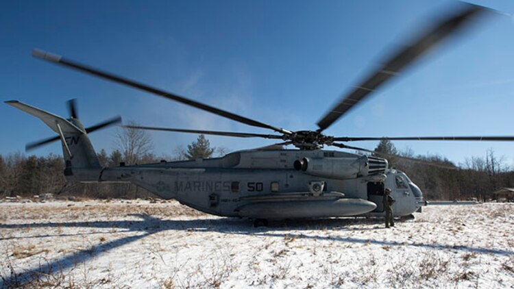 Marines with Marine Heavy Helicopter Squadron 464 land a CH-53 Super Stallion during a confined area landing exercise as part of the unit’s deployment for training exercise aboard Camp Dawson, West Virginia, Jan. 31, 2015. The goal of the DFT is to prepare the squadron to work and effectively accomplish their mission in a different environment than they are used to.