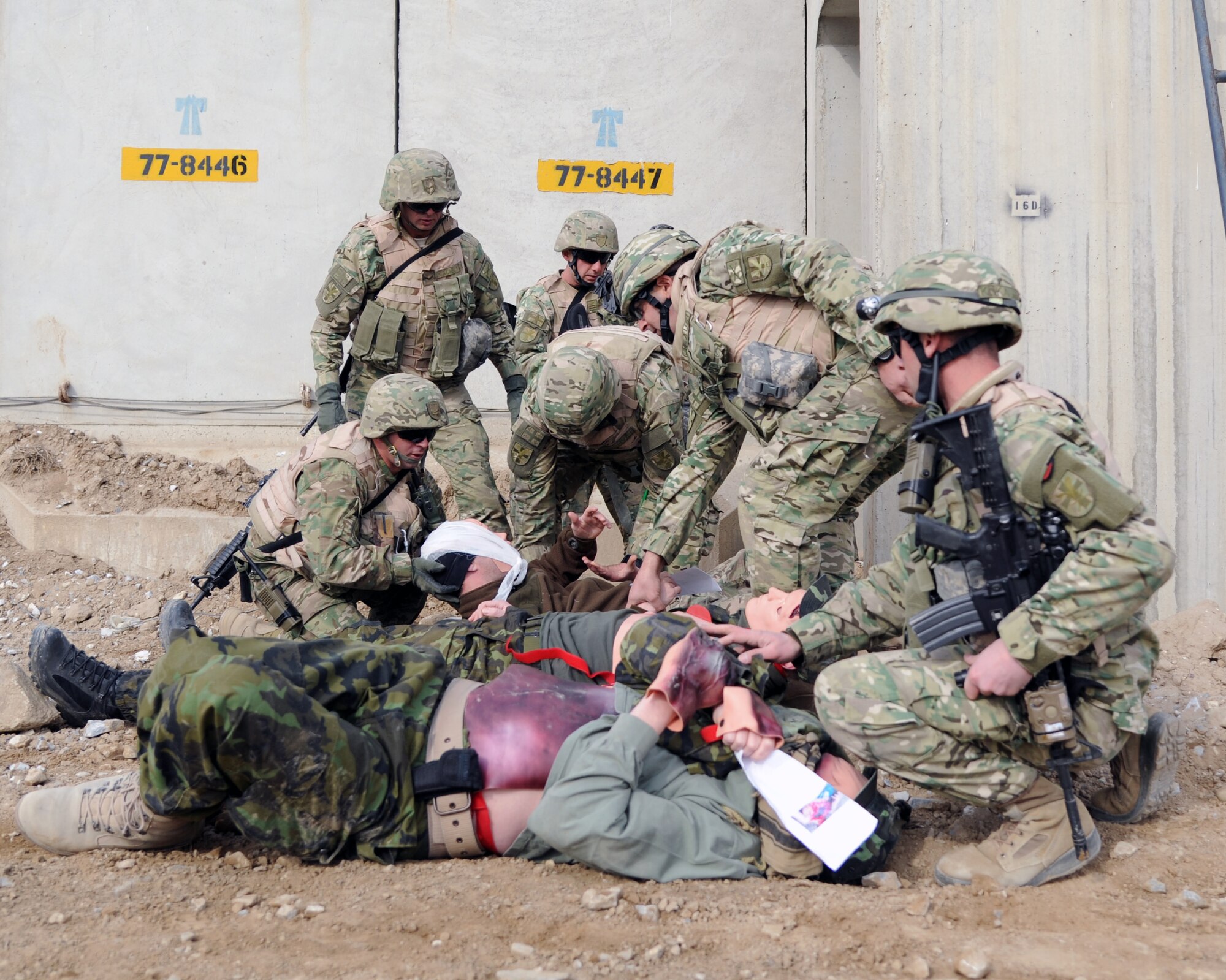 Georgian servicemen provide first aid during a combined-joint training exercise at Bagram Airfield, Afghanistan Feb. 6, 2015. U.S. and Georgian service members participated in the base-wide exercise enhancing their abilities to respond in the event of attacks on the base and mass casualty incidents.  (U.S. Air Force photo by Master Sgt. James Law/released)