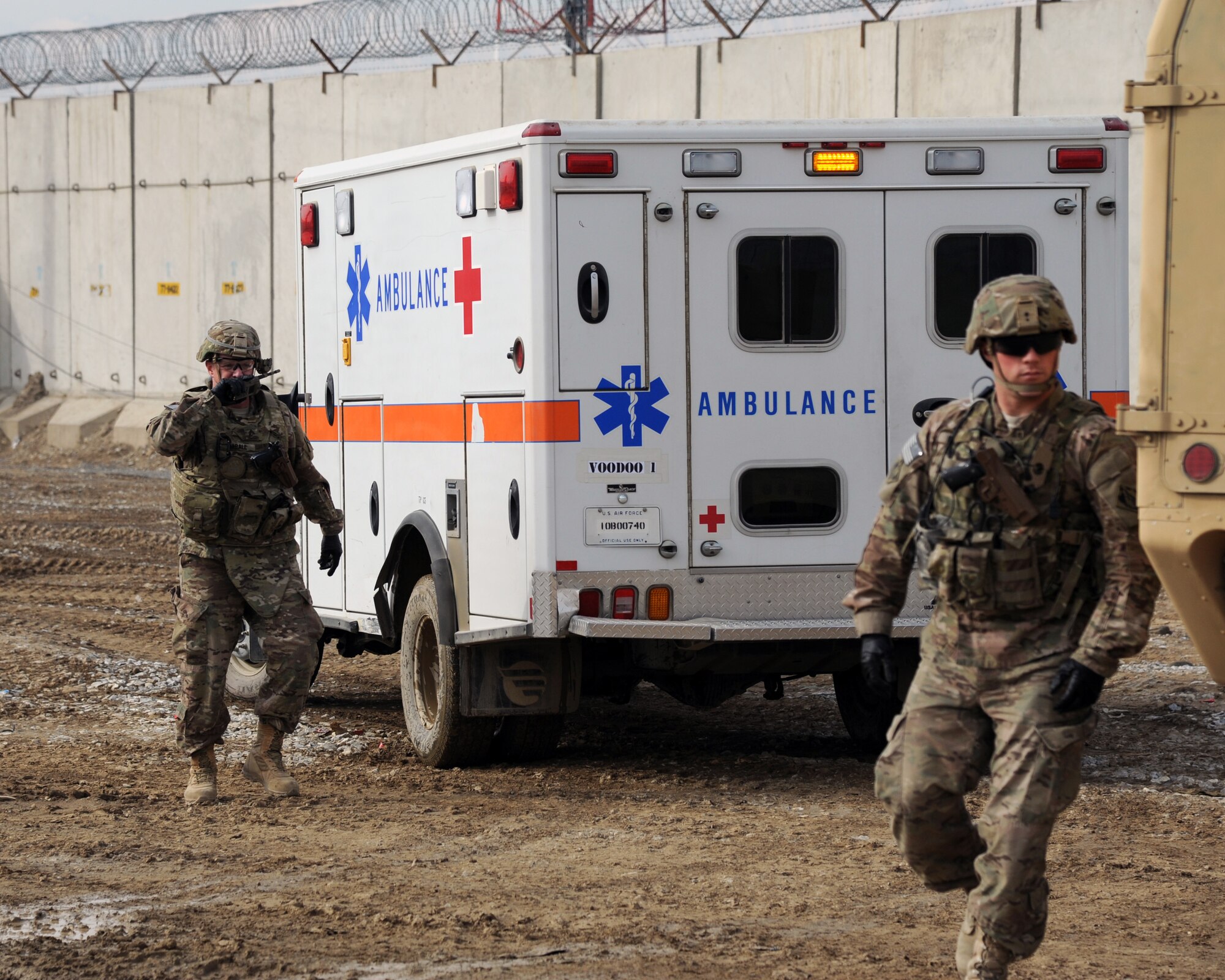 U.S. Army soldiers respond to a mass casualty site during a combined-joint training exercise at Bagram Airfield, Afghanistan Feb. 6, 2015. U.S. and Georgian service members participated in the base-wide exercise enhancing their abilities to respond in the event of attacks on the base and mass casualty incidents.  (U.S. Air Force photo by Master Sgt. James Law/released)
