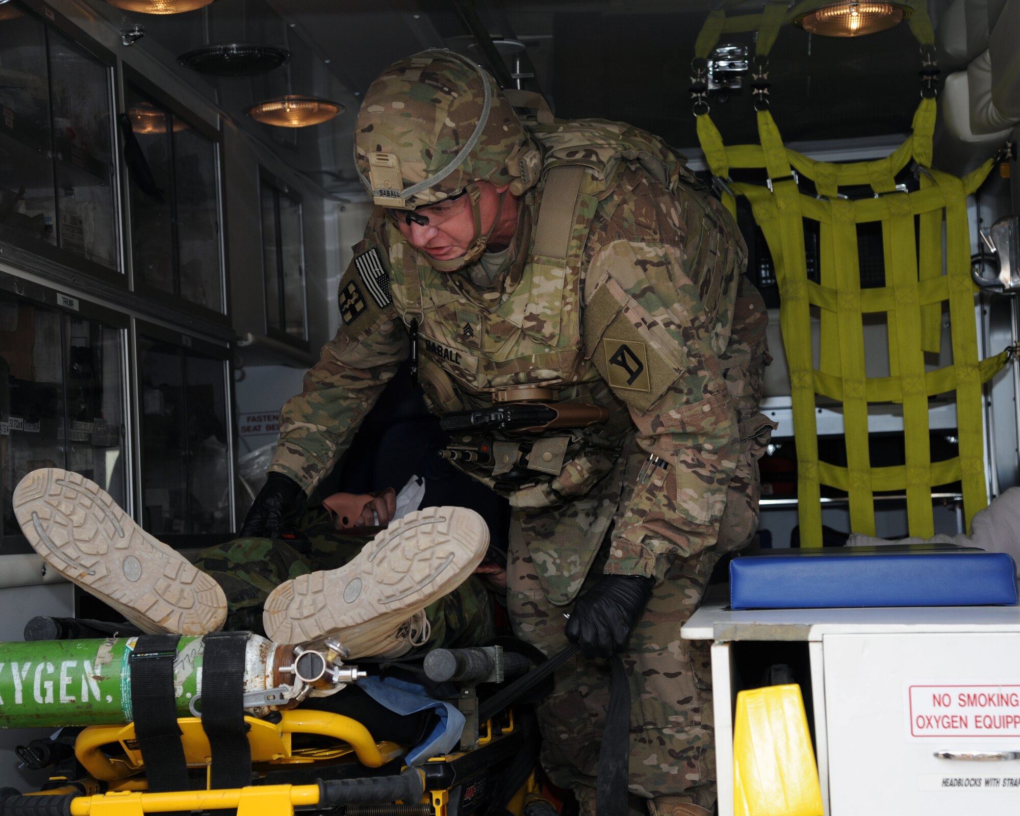 A U.S. Army soldier prepares a patient for transport during a combined-joint training exercise at Bagram Airfield, Afghanistan Feb. 6, 2015. U.S. and Georgian service members participated in the base-wide exercise enhancing their abilities to respond in the event of attacks on the base and mass casualty incidents.  (U.S. Air Force photo by Master Sgt. James Law/released)