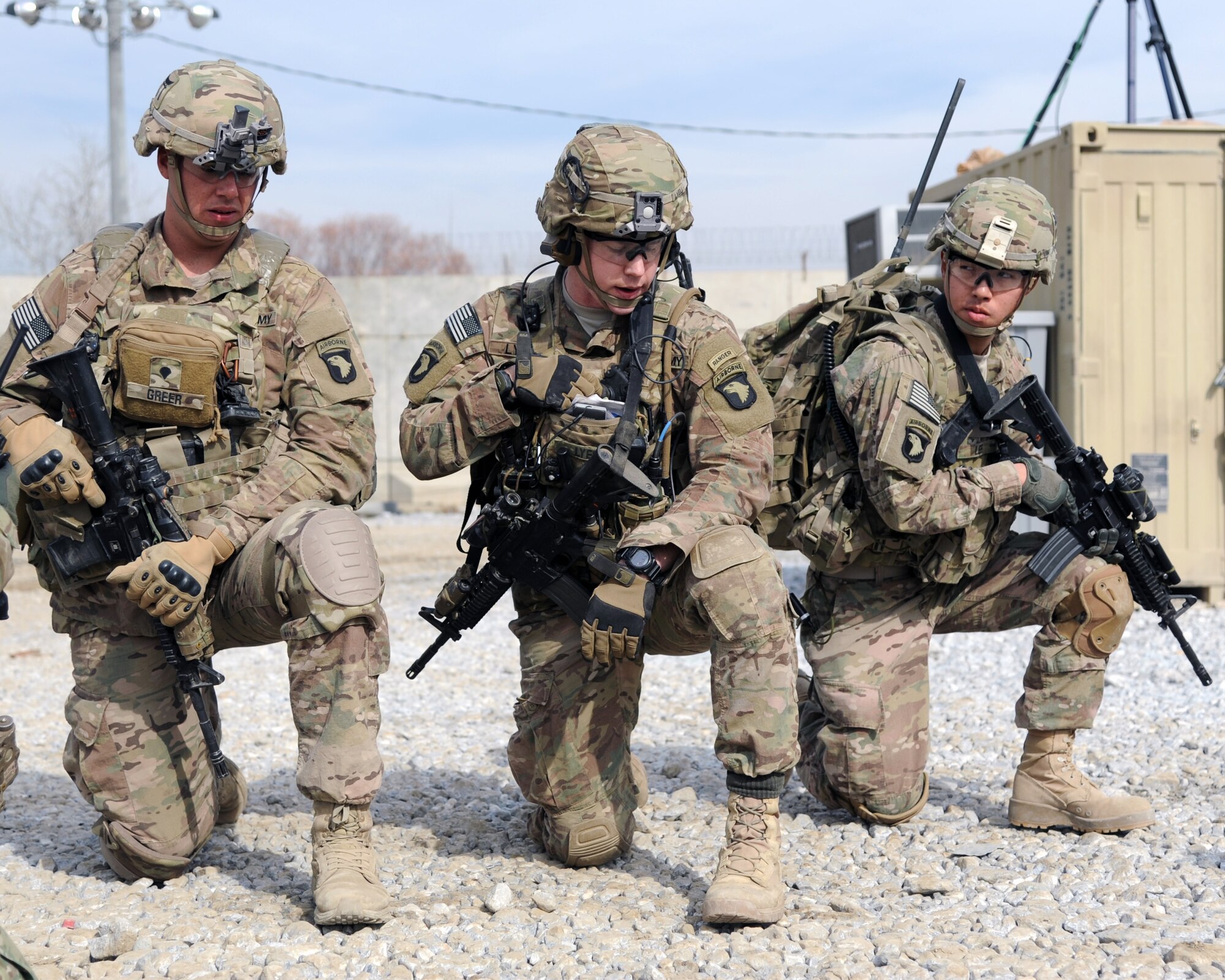 U.S. Army soldiers radio in their position during a combined-joint training exercise at Bagram Airfield, Afghanistan Feb. 6, 2015. U.S. and Georgian service members participated in the base-wide exercise enhancing their abilities to respond in the event of attacks on the base and mass casualty incidents.  (U.S. Air Force photo by Master Sgt. James Law/released)