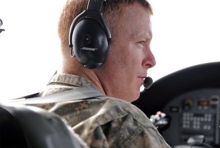 Chief Warrant Officer 3 Timothy Curran, an Alaska Regional Flight Center UC-35 pilot, flies the twin-engine 7-passenger plane during a short hop from Fort Greely to Elmendorf Air Force Base April 26, 2010.