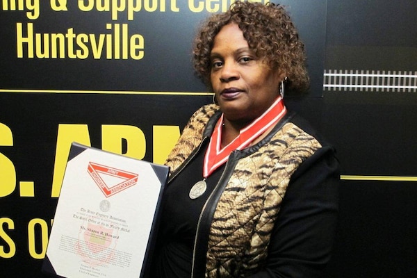 Sharon Howard, of the Engineering and Support Center, Huntsville, receives the Army Corps of Engineers Steel Order of the de Fleury Medal for her efforts while deployed to Afghanistan.   