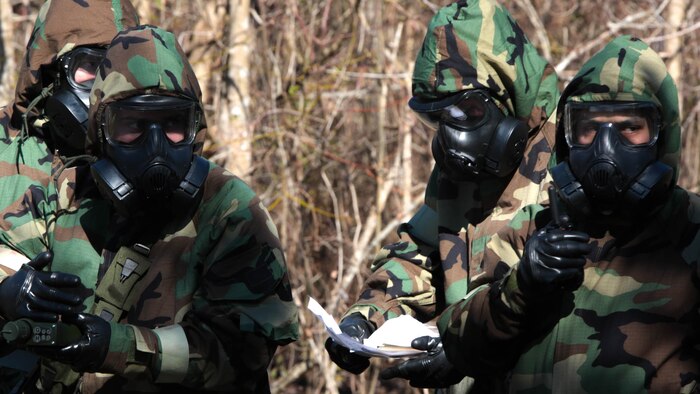 Marines from Marines Forces Reserve practice how to properly report a casualty and possible toxic gas during a chemical, biological, radiological and nuclear defense training simulation aboard Naval Air Station Joint Reserve Base New Orleans, Feb. 5, 2015. When they locate a casualty, Marines must report it to the control center and wait for further instructions. The CBRN defense training equips Marines from diverse units, with the proper knowledge and readiness needed to handle a real combat zone situation.