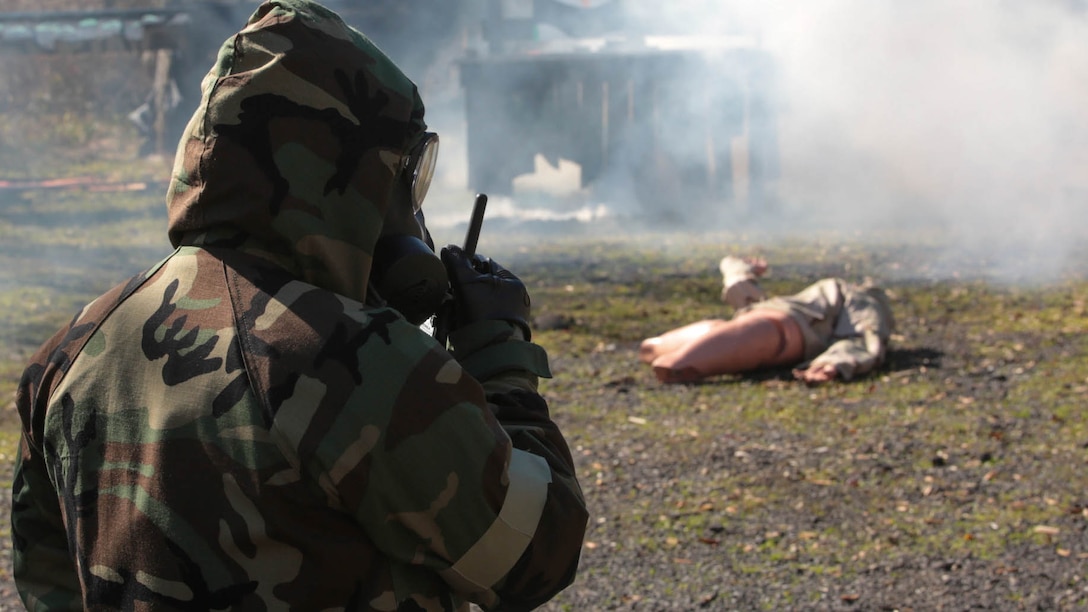Marines from Marines Forces Reserve practice how to properly report a casualty and possible toxic gas during a chemical, biological, radiological and nuclear defense training simulation aboard Naval Air Station Joint Reserve Base New Orleans, Feb. 5, 2015. When they locate a casualty, Marines must report it to the control center and wait for further instructions. The CBRN defense training equips Marines from diverse units, with the proper knowledge and readiness needed to handle a real combat zone situation. 