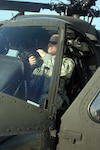 Missouri National Guard Capt. Nicholas Pianalto makes equipment adjustments in the pilot's seat of a UH-60 Black Hawk helicopter on the air field of the Christopher S. “Kit” Bond Army Aviation Support Facility at Fort Leonard Wood. Pianalto, who lives in Waynesville, and three other Missouri Guardsman took off from Fort Leonard Wood to help with the response to the oil spill in the Gulf of Mexico May 26, 2010.
