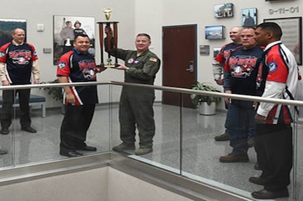 The NORAD-USNORTHCOM silver softball team presented their base championship trophy to Lt. Gen. Michael Dubie, deputy commander United States Northern Command, and vice commander, U.S. Element, North American Aerospace Defense Command here Feb. 2, 2015.