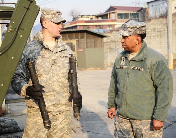 REDSTONE ARSENEL, Alaska. (Feb. 10, 2015) - In this photo file, Sgt. Stovall, with the 23rd Chemical, Biological, Radiological, Nuclear, and highly-yield Explosive Battalion, 1st Armored Brigade Combat Team, demonstrates equipment for Gen. Dennis L. Via, commander of the U.S. Army Materiel Command.   