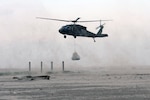 UH-60 Blackhawk helicopters belonging to the 1/244th Assault Helicopter Battalion, State Aviation Command of the Louisiana Army National Guard sling load several thousand pound sandbags to Trinity Island to fill in a low lying area critical to oil spill mitigation efforts along Louisiana’s shoreline in Hammond, La., May 27, 2010. Trinity Island is one of many barrier islands along the coast of Louisiana that are threatened by the oil spill.