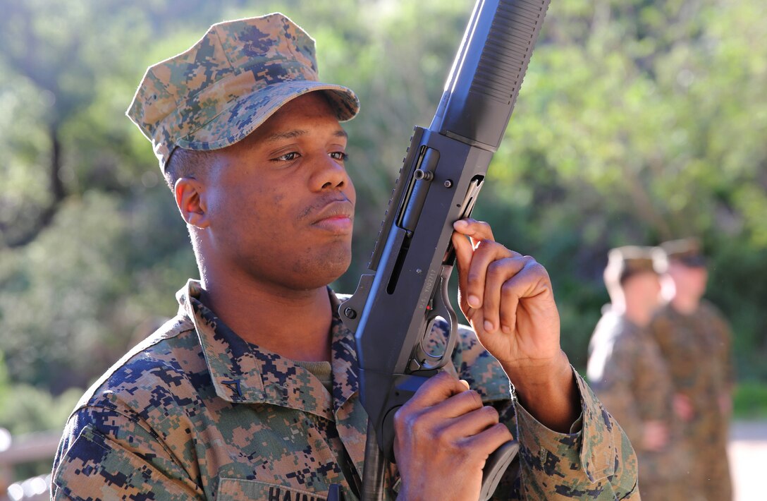 Marines from Headquarters and Support Battalion learned basic marksmanship skills using the M1014 combat shotgun and the M9 service pistol at range 206, Feb. 11. The Marines competed in friendly competitions to improve team morale such as a sprint followed by a speed load and shoot. 