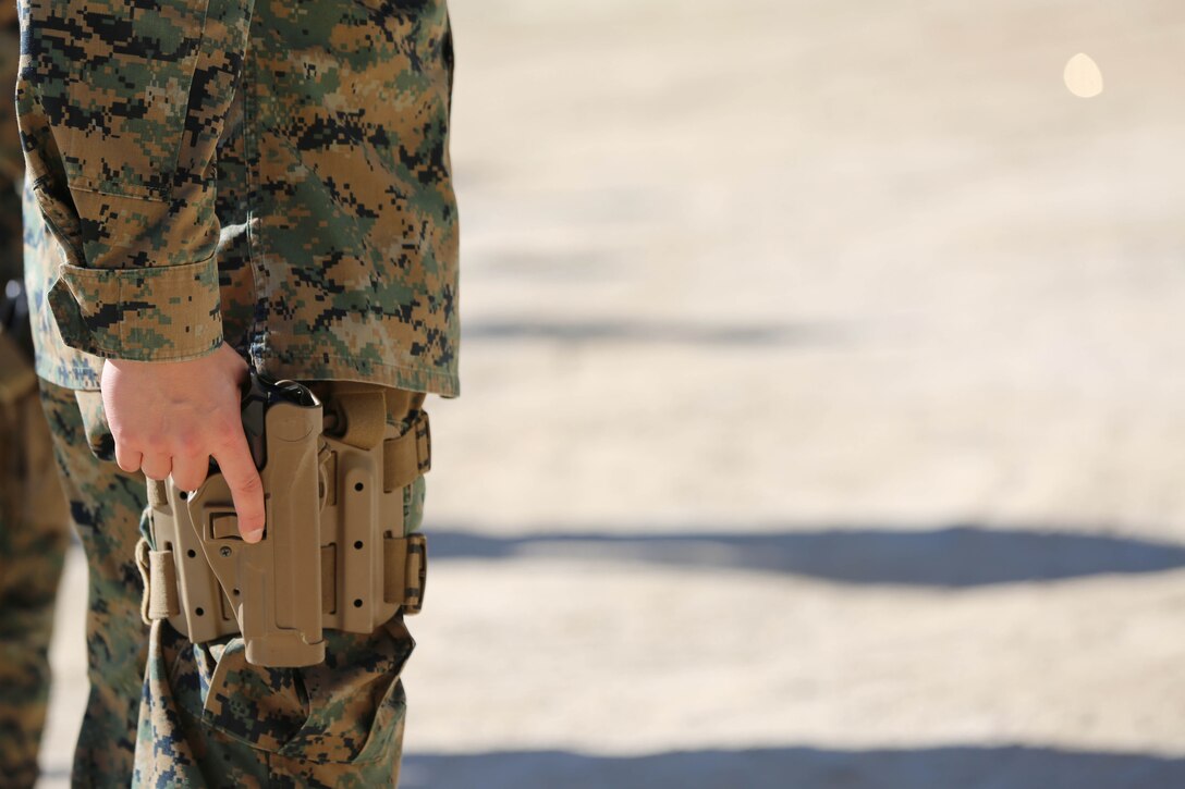 Marines from Headquarters and Support Battalion learned basic marksmanship skills using the M1014 combat shotgun and the M9 service pistol at range 206, Feb. 11. The Marines competed in friendly competitions to improve team morale such as a sprint followed by a speed load and shoot. 