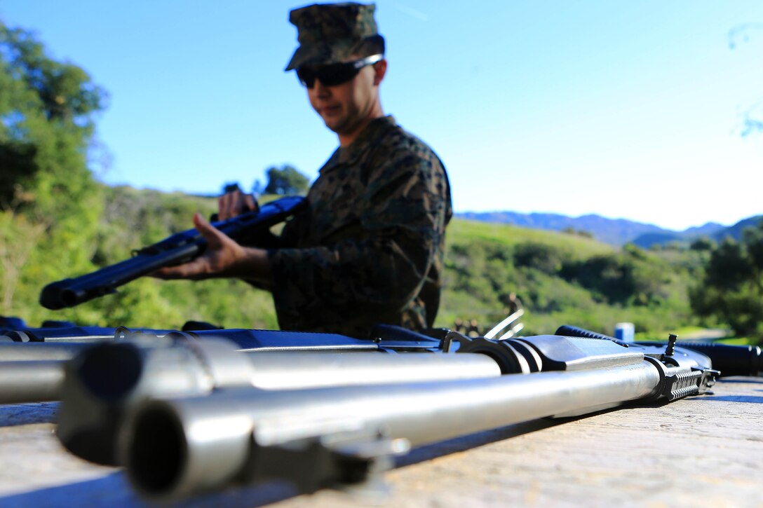 Marines from Headquarters and Support Battalion learned basic marksmanship skills using the M1014 combat shotgun and the M9 service pistol at range 206, Feb. 11. The Marines competed in friendly competitions to improve team morale such as a sprint followed by a speed load and shoot. 