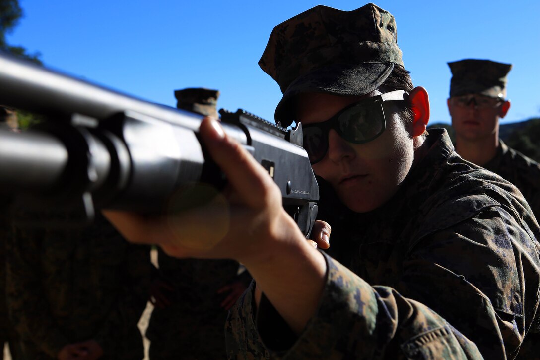 Marines from Headquarters and Support Battalion learned basic marksmanship skills using the M1014 combat shotgun and the M9 service pistol at range 206, Feb. 11. The Marines competed in friendly competitions to improve team morale such as a sprint followed by a speed load and shoot. 
