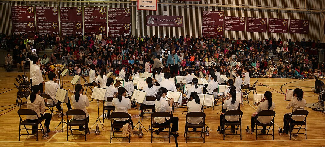 The Shinnanyo High School Brass Band performs the “Star-Spangled Banner” for the staff and students of Matthew C. Perry Elementary School aboard Marine Corps Air Station Iwakuni, Japan, Feb. 11, 2015. M. C. Perry hosted their 5th annual Japanese Cultural Exchange Program at the school’s gymnasium, which included traditional martial arts, a classical Japanese dance and musical performances. 