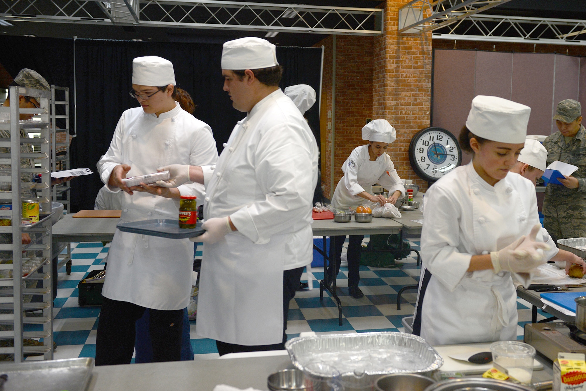 Students from Kadena High School take part in the 2015 Far East Culinary Arts competition at Yokota Air Base, Japan, Feb. 5, 2015. Teams of four students were given one hour to prepare a three-course meal using only two butane burners. (U.S. Air Force photo by Airman 1st Class David C. Danford/Released)