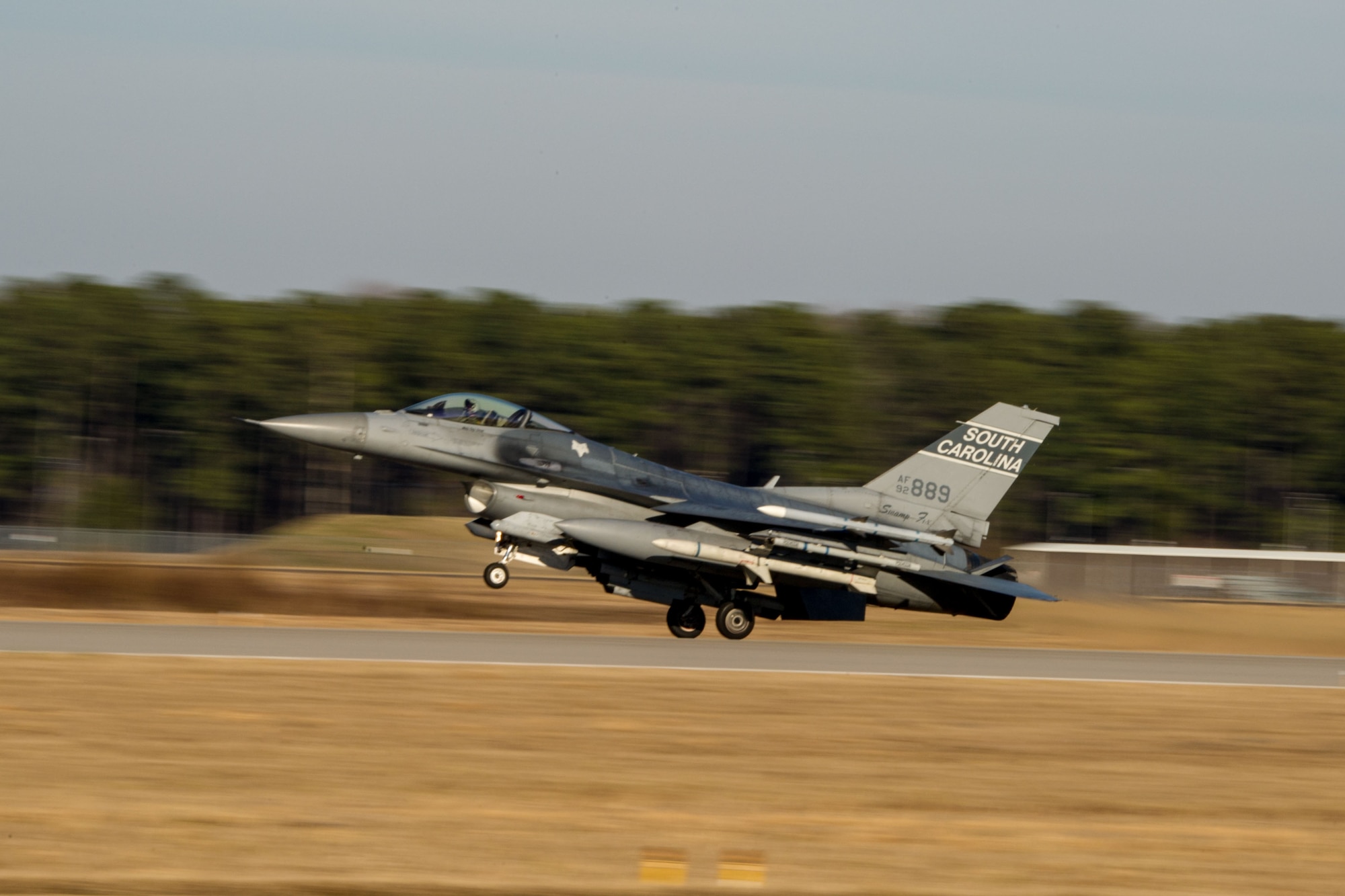 A U.S. Air Force F-16 fighter jet, assigned to the 169th Fighter Wing, lands during surge flying operations, Feb. 7, 2015, at McEntire Joint National Guard Base, S.C. The surge encompasses high tempo flying as part of vital training in preparation for deployments. (U.S. Air National Guard photo by Tech. Sgt. Jorge Intriago/Released)