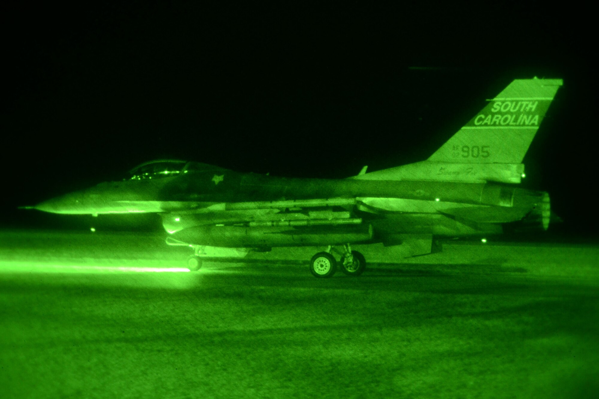 A U.S. Air Force fighter pilot, assigned to the 157th Fighter Squadron at McEntire Joint National Guard Base, South Carolina Air National Guard, taxis to launch an F-16 Fighting Falcon during surge flying operations Feb. 7, 2015.  The surge encompasses high tempo flying as part of vital training for deployments. (U.S. Air National Guard photo by Amn Megan Floyd/Released)