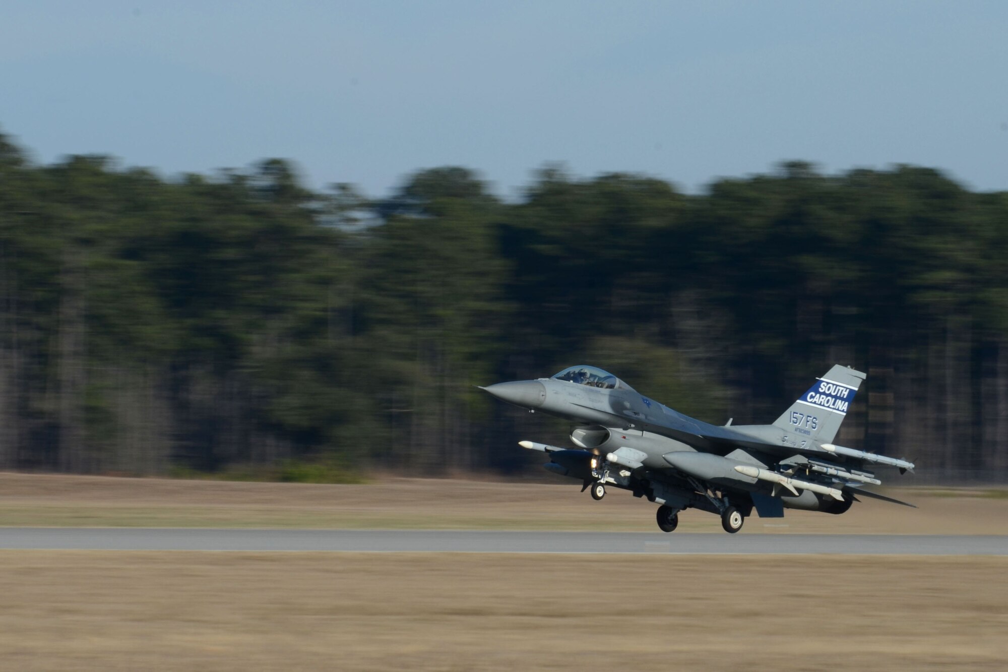 A South Carolina Air National Guard F-16 Fighting Falcon lands at McEntire Joint National Guard Base, after a training mission during surge flying operations Feb. 7, 2015. The surge encompasses high tempo flying as part of vital training in preparations for deployments. (U.S. Air National Guard photo by Amn Megan Floyd/Released)