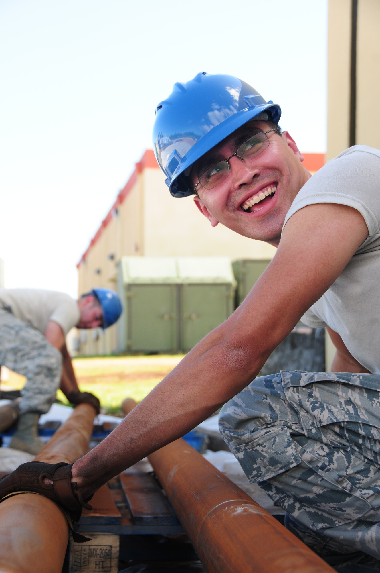 U.S. Air National Guard Senior Airman Guillermo Diaz-Garcia with the 146th Airlift Wing Civil Engineering Squadron prepares pipes to be installed at the 554th Red Horse Squadron, Andersen Air Force Base, Guam on January 29, 2015. (U.S. Air National Guard photo by Airman 1st Class Madeleine Richards/Released)