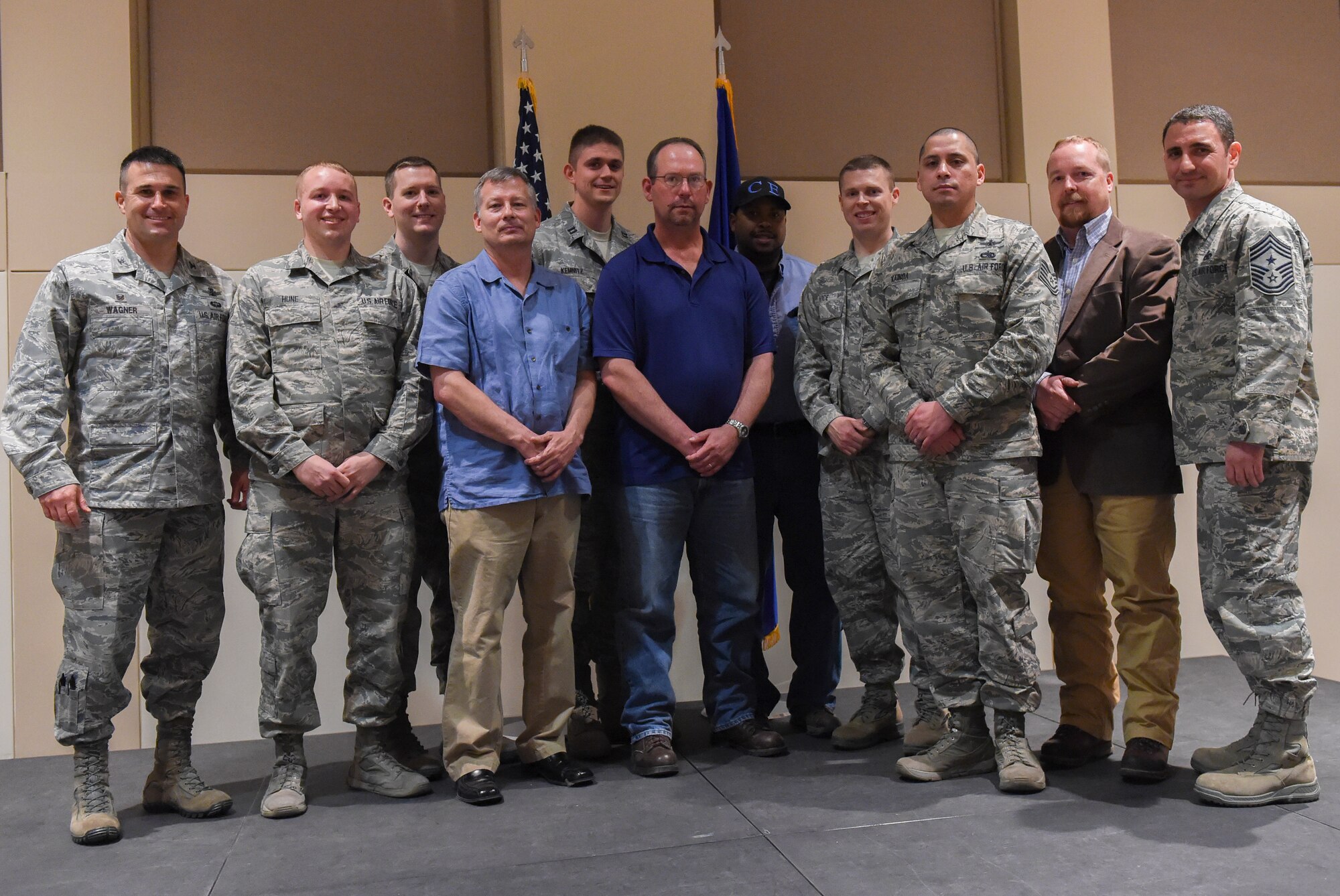 The winners of the 2014 460th Space Wing Annual Awards pose after the ceremony Feb. 11, 2015, at the Leadership Development Center on Buckley Air Force Base, Colo. The annual awards included 10 individual awards and one team excellence award. (U.S. Air Force photo by Airman 1st Class Samantha Saulsbury/Released)