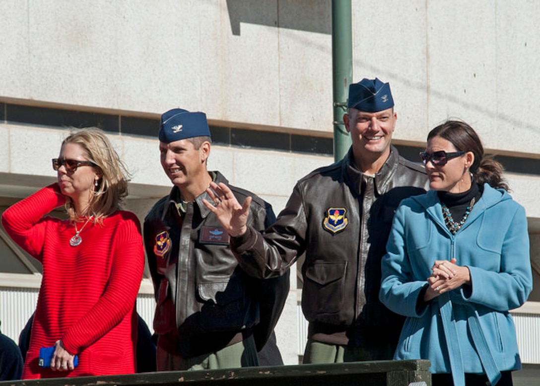 80th Flying Training Wing Commander, Colonel Lance Bunch, and Emily
Bunch (right),  join 80th FTW Vice Commander  Col. Gregory Keeton and
Lori Keeton, on the 2014 North Texas Veterans Day Parade reviewing stand Nov.
8, 2014 in Wichita Falls, Tx.  Col. and Mrs. Bunch are the 2015 AETC winners
of the General and Mrs. Jerome O'Malley Award, which recognizes the wing
commander and spouse team whose contributions to the nation, the Air Force,
and the local community best exemplify the highest ideals and positive
leadership of a military couple serving in a key Air Force position. Col.
and Mrs. Bunch now prepare for a new assignment and new community at Air
Force Central Command, MacDill AFB, Fla.  (USAF Photo/Debi Smith) 
