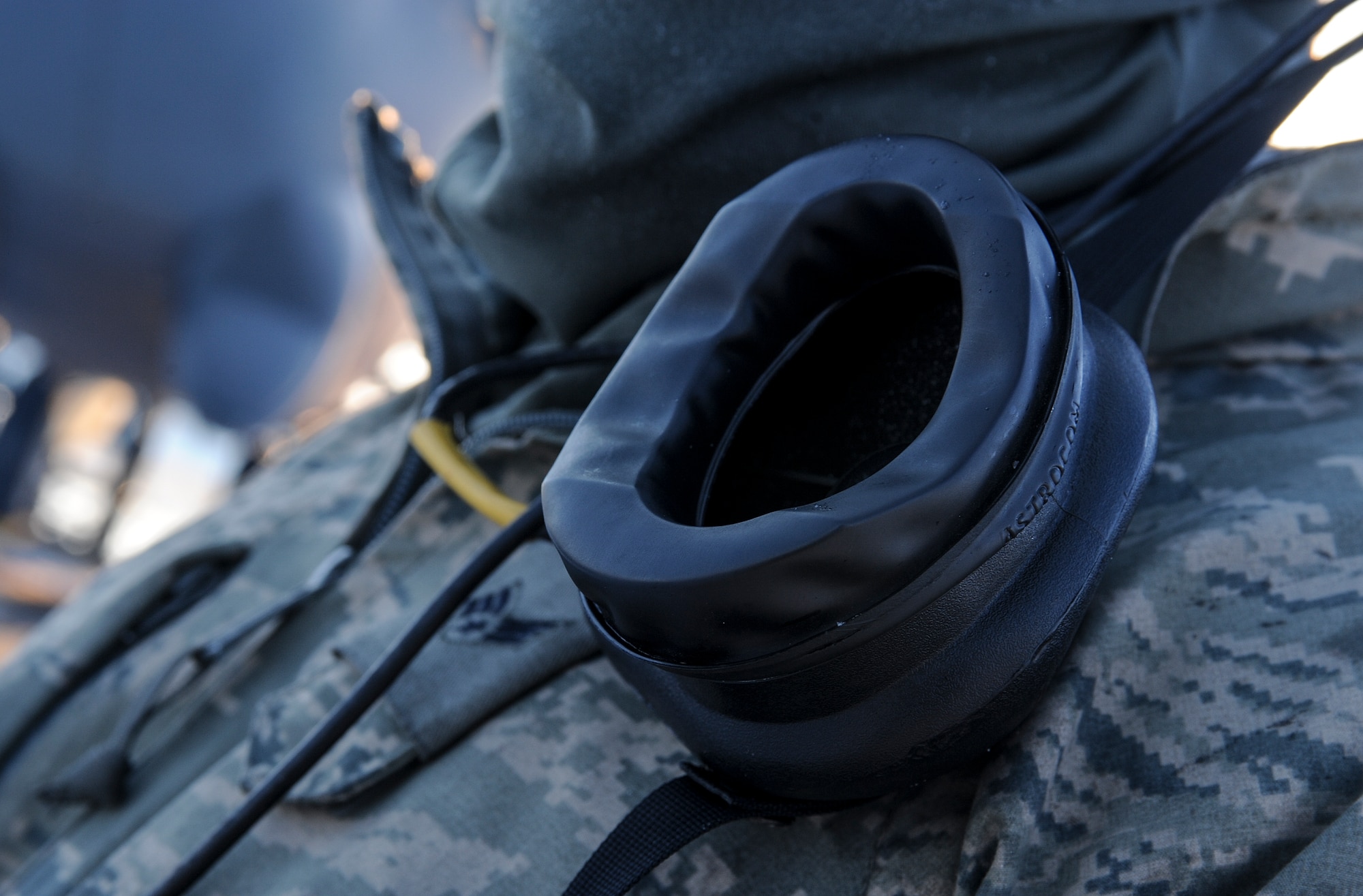A mouthpiece used for communicating with aircrew inside a B-52H Stratofortress rests on the shoulder of a 5th Aircraft Maintenance Squadron crew chief on Minot Air Force Base, N.D., Feb. 4, 2015. Aircrew alert crew chiefs to any discrepancies they notice from the cockpit while the crew chiefs let them know what’s happening outside. (U.S. Air Force photo/Senior Airman Stephanie Morris)