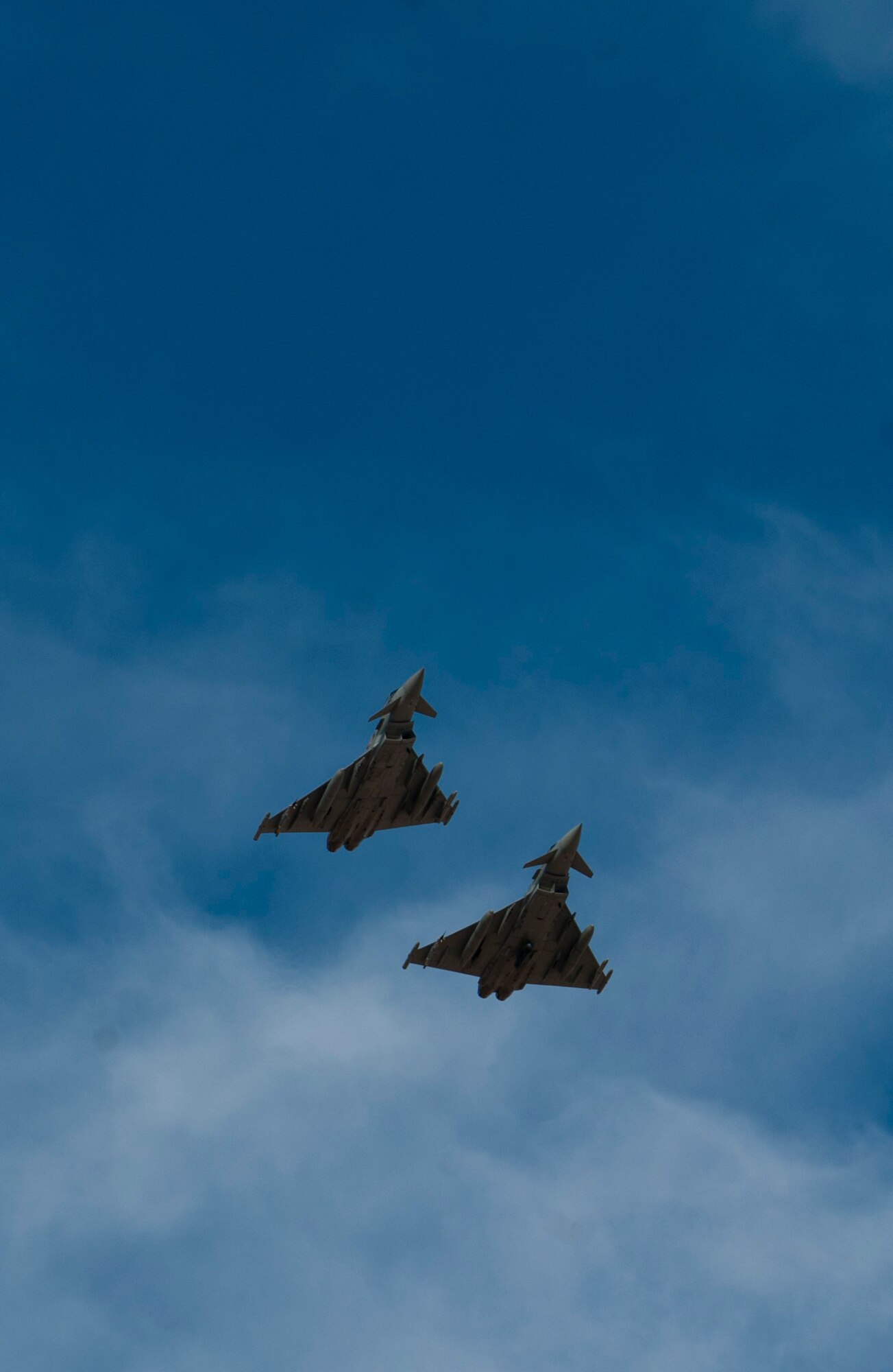 Two Royal Air Force Typhoon FGR4s assigned to 1 (Fighter) Squadron, RAF Lossiemouth, Scotland, prepare to land during Red Flag 15-1 at Nellis Air Force Base, Nev., Feb. 6, 2015. All four branches of the U.S. military and air forces from allied nations have participated in Red Flag. The training is conducted to familiarize forces to work together in future real-world operations. (U.S. Air Force photo by Senior Airman Thomas Spangler)