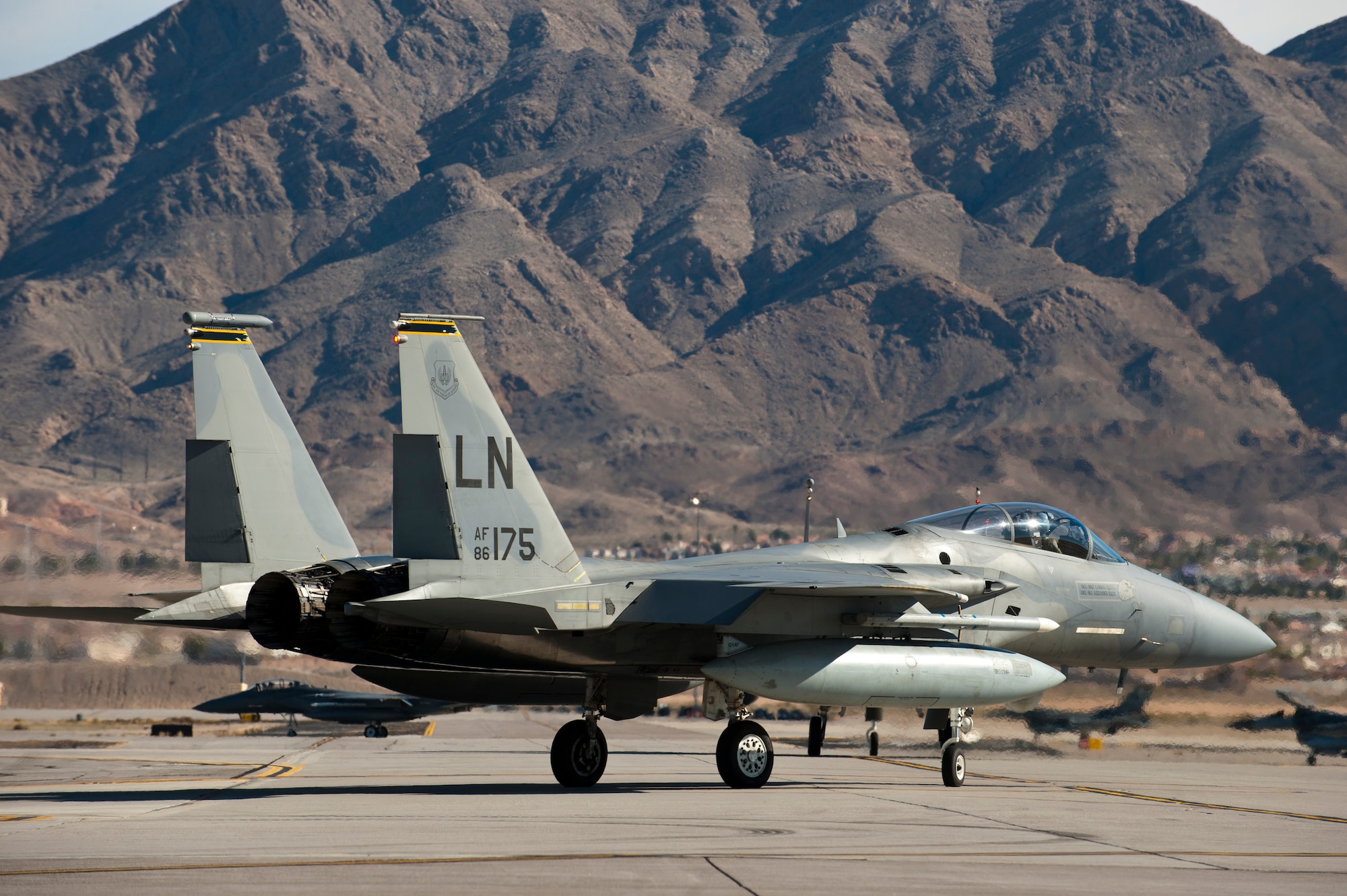 An F-15C Eagle assigned to the 493rd Fighter Squadron, Royal Air Force Lakenheath, England, taxis to the runway during Red Flag 15-1 at Nellis Air Force Air Force Base, Nev., Feb. 6, 2015. Red Flag provides realistic combat training in a contested, degraded and operationally limited environment. (U.S. Air Force photo by Senior Airman Thomas Spangler)