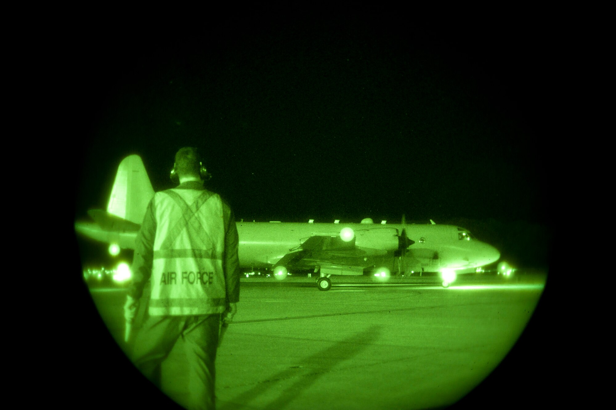 A Royal Australian air force aircraft maintainer watches as an RAAF AP-3C Orion assigned to 10 Squadron, RAAF Edinburgh, Australia, taxis to the runway during Red Flag 15-1 at Nellis Air Force Base, Nev., Feb. 9, 2015. Red Flag is an exercise hosted at Nellis AFB that provides aircrews an opportunity to experience realistic, stressful combat situations in a controlled environment to increase mission capability. (U.S. Air Force photo by Senior Airman Thomas Spangler)