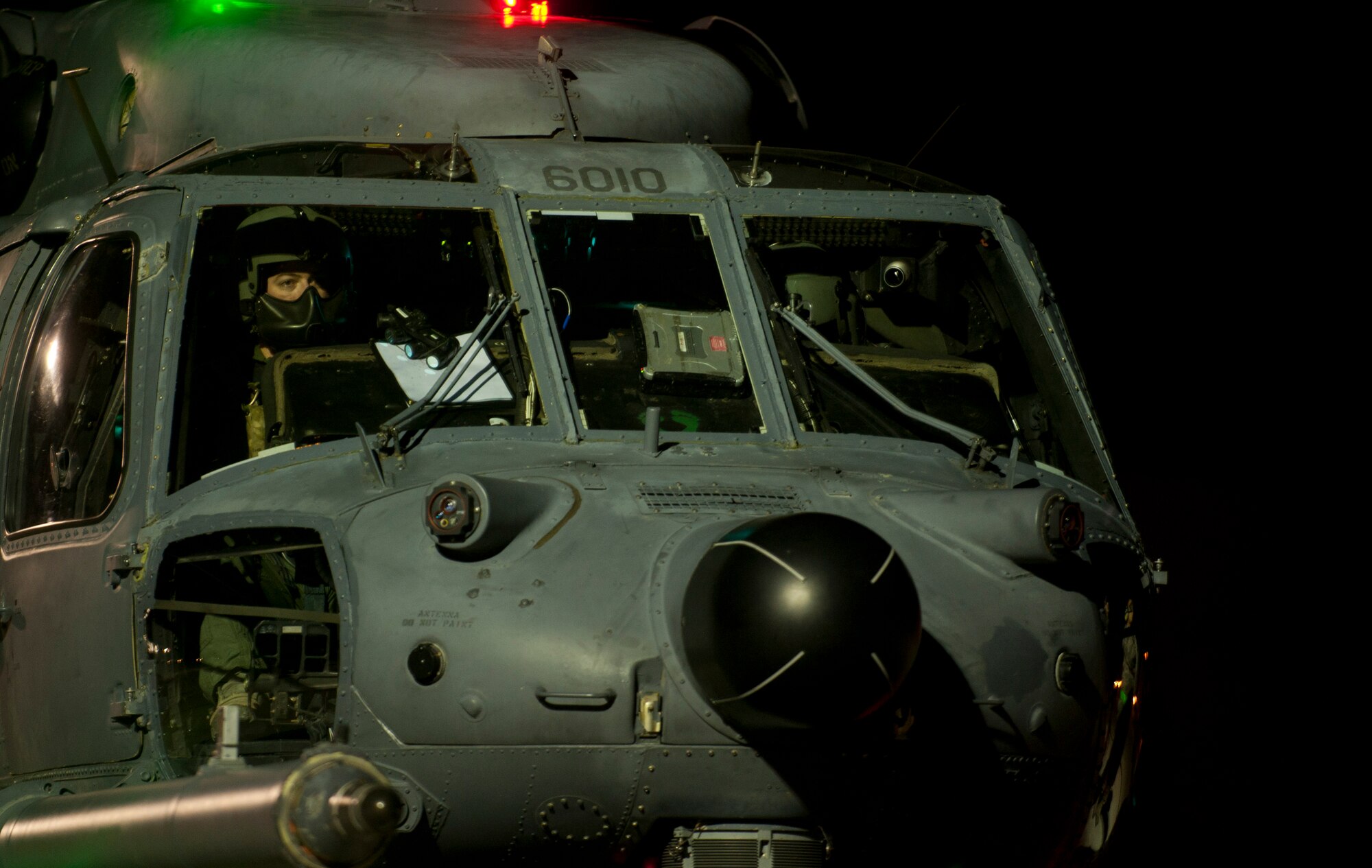 A pilot assigned to the 66th Rescue Squadron makes final preparations before takeoff before participating in a Red Flag 15-1 personnel recovery training scenario at Nellis Air Force Base, Nev., Feb. 5, 2015. Southern Nevada’s 2.9 million acre Nevada Test and Training Range offers warfighters a realistic, contested and degraded conflict zone that ensures that the highest levels of proficiency can be maintained. (U.S. Air Force photo by Airman 1st Class Joshua Kleinholz)