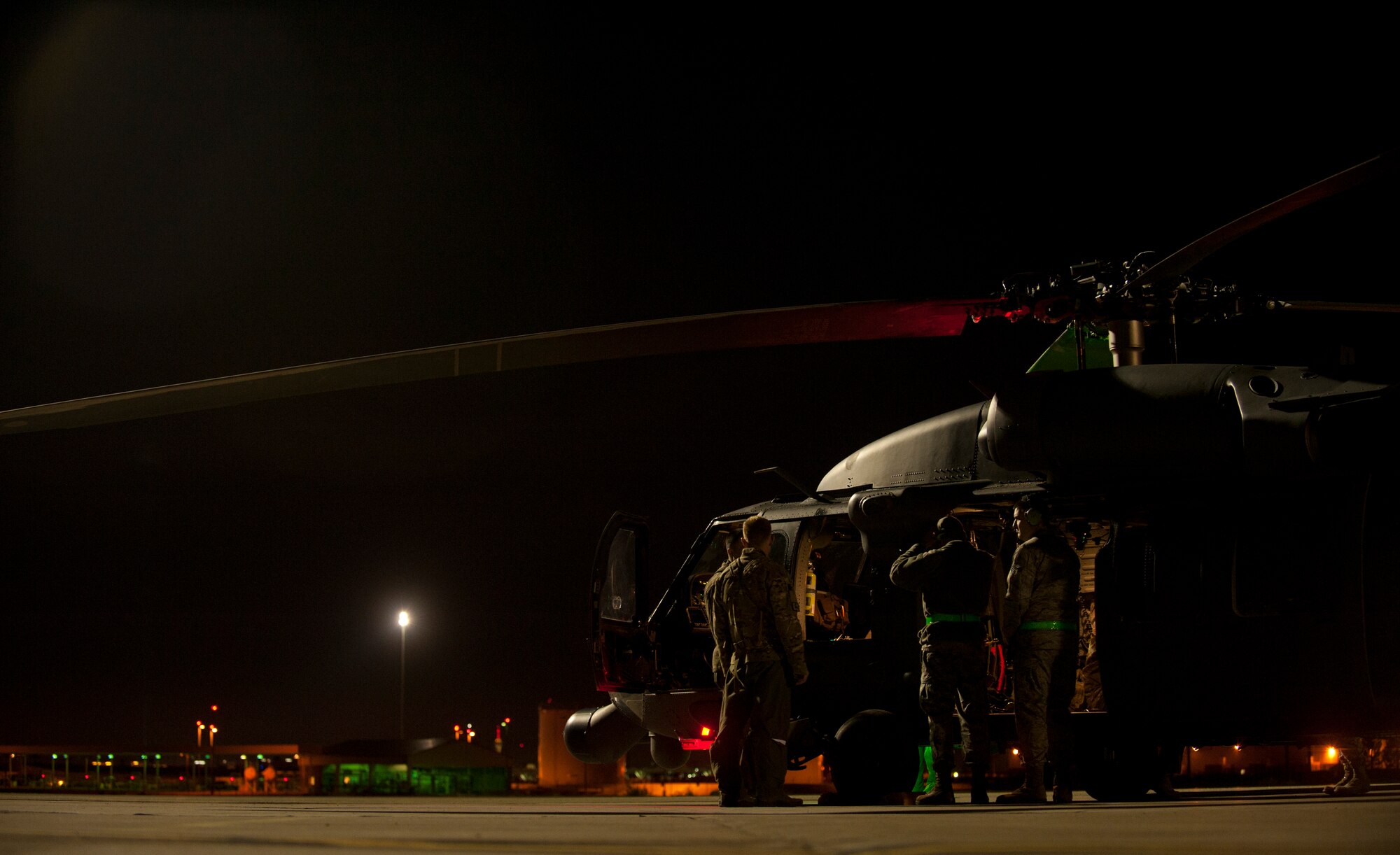 An HH-60G Pave Hawk assigned to the 66th Rescue Squadron is serviced by maintainers prior to a Red Flag 15-1 personnel recovery training scenario at Nellis Air Force Base, Nev., Feb. 5, 2015. The Pave Hawk is a four bladed, twin engine, single-rotor helicopter that is designed to carry a crew of four and a combat-equipped squad of 11 or an equal cargo load. (U.S. Air Force photo by Airman 1st Class Joshua Kleinholz)