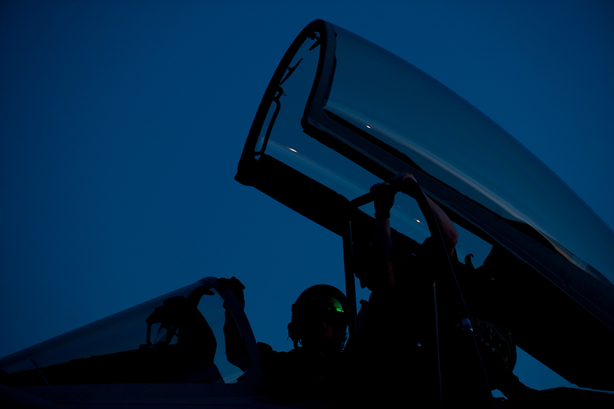 A Royal Air Force pilot assigned to  1 (Fighter) Squadron, RAF Lossiemouth, Scotland, converses with his Typhoon GR4’s assigned crew chief prior to a Red Flag 15-1 night training sortie at Nellis Air Force Base, Nev., Feb. 4, 2015. Night missions play a crucial role in Red Flag exercises, allowing aircrews and maintainers the opportunity to test their skills in challenging low-light conditions. (U.S. Air Force photo by Airman 1st Class Joshua Kleinholz)