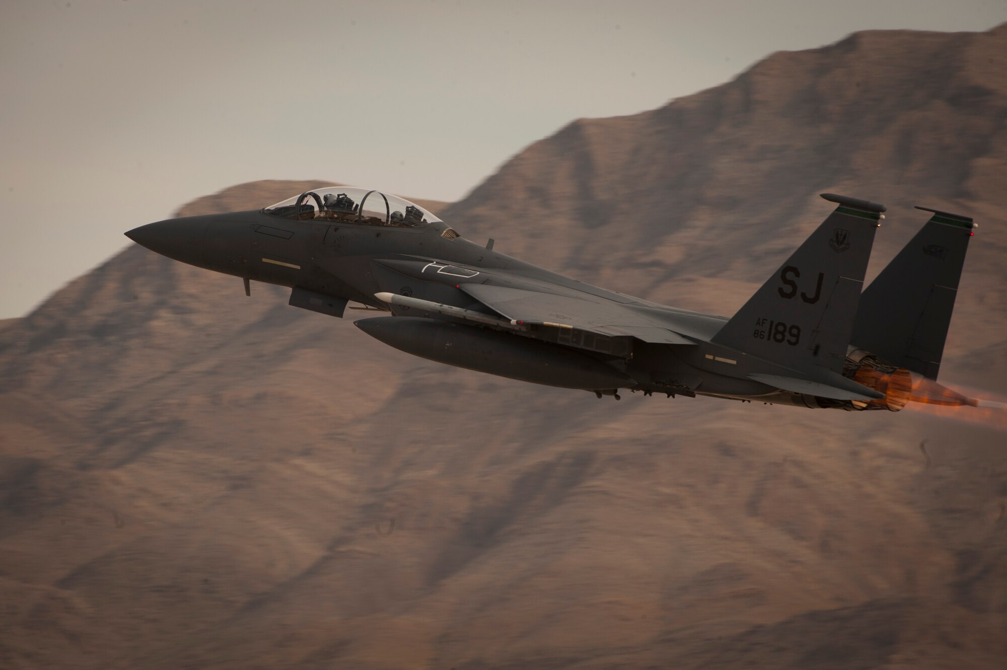 An F-15E Strike Eagle assigned to the 335th Fighter Squadron, Seymour Johnson Air Force Base, N.C., takes off from Nellis Air Force Base, Nev., to take part in a Red Flag 15-1 training sortie over the Nevada Test and Training Range Feb. 4, 2015. Various units from around the Air Force, joint branches and coalition partners converge on Nellis three to four times a year to take part in the exercise, which puts to test the participant force’s air, space, cyber and combat search and rescue capabilities. (U.S. Air Force photo by Airman 1st Class Joshua Kleinholz)