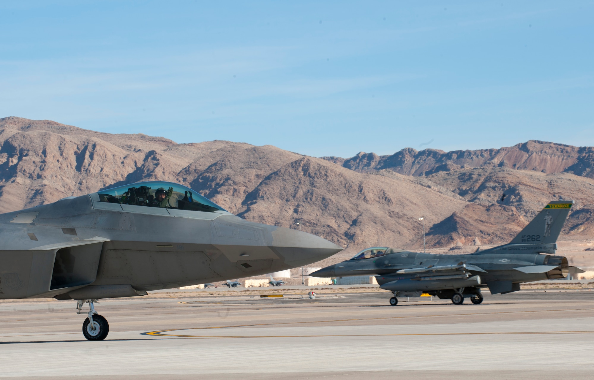 An F-22A Raptor assigned to the 94th Fighter Squadron, Joint Base Langley-Eustis, Va., taxis  out to the runway at the start of a Red Flag 15-1 training sortie  at Nellis Air Force Base, Nev., Feb. 2, 2015. Red Flag exercises bring joint and coalition air, space and cyber units together against a common adversary in order to further build tactical cohesion.  (U.S. Air Force photo by Airman 1st Class Joshua Kleinholz)