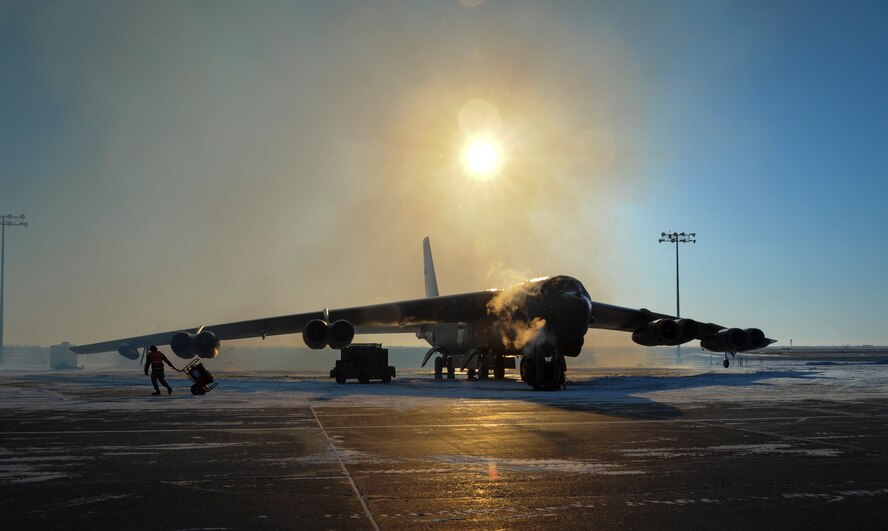 Cold fog filters past a B-52H Stratofortress on the flightline on Minot Air Force Base, N.D., Feb. 4, 2015. The aircraft underwent several preflight checks prior to takeoff. (U.S. Air Force photo/Senior Airman Stephanie Morris)